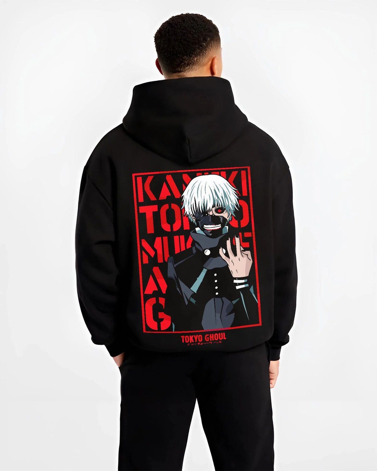 Black hoodie worn by male model from the back featuring Ken Kaneki one-eye ghoul portrait artwork.