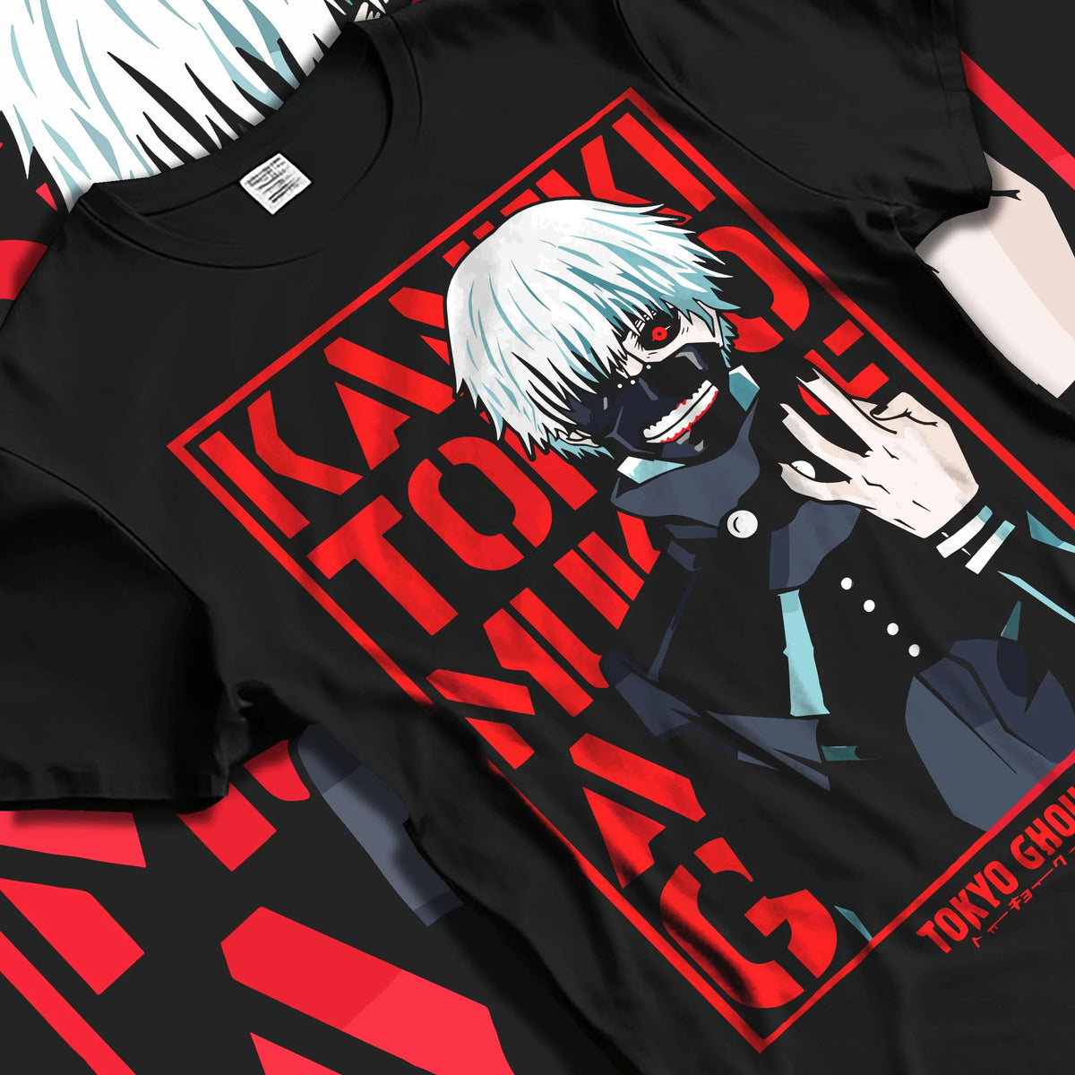 Black T-shirt laid flat with natural folds featuring Ken Kaneki one-eye ghoul portrait artwork.