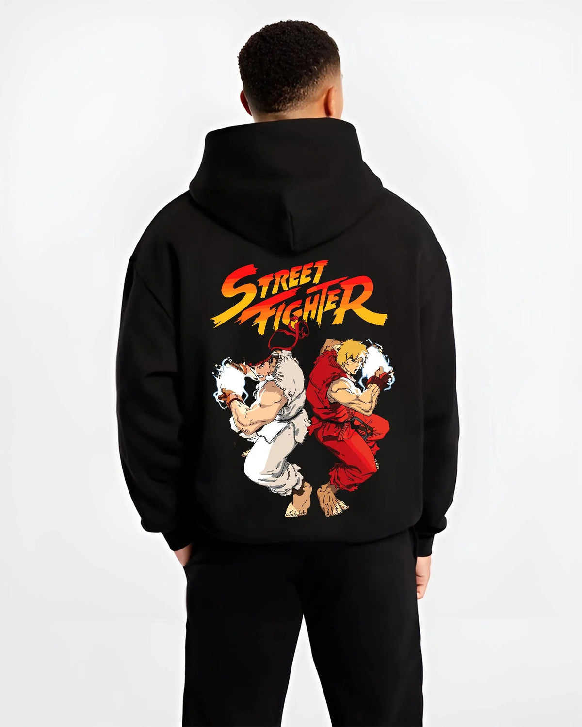 Black hoodie worn by male model from the back featuring Ken Masters and Ryu rival battle artwork.