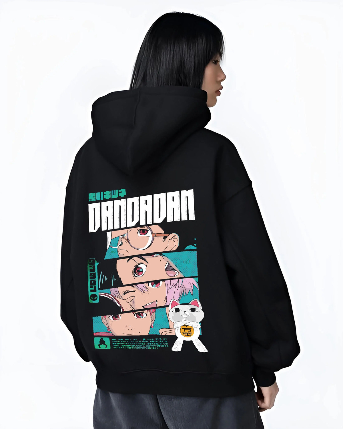 Black hoodie female model back view showing Dandadan ensemble: Okarun, Momo, Aira, Jiji and Turbo Granny (cat)