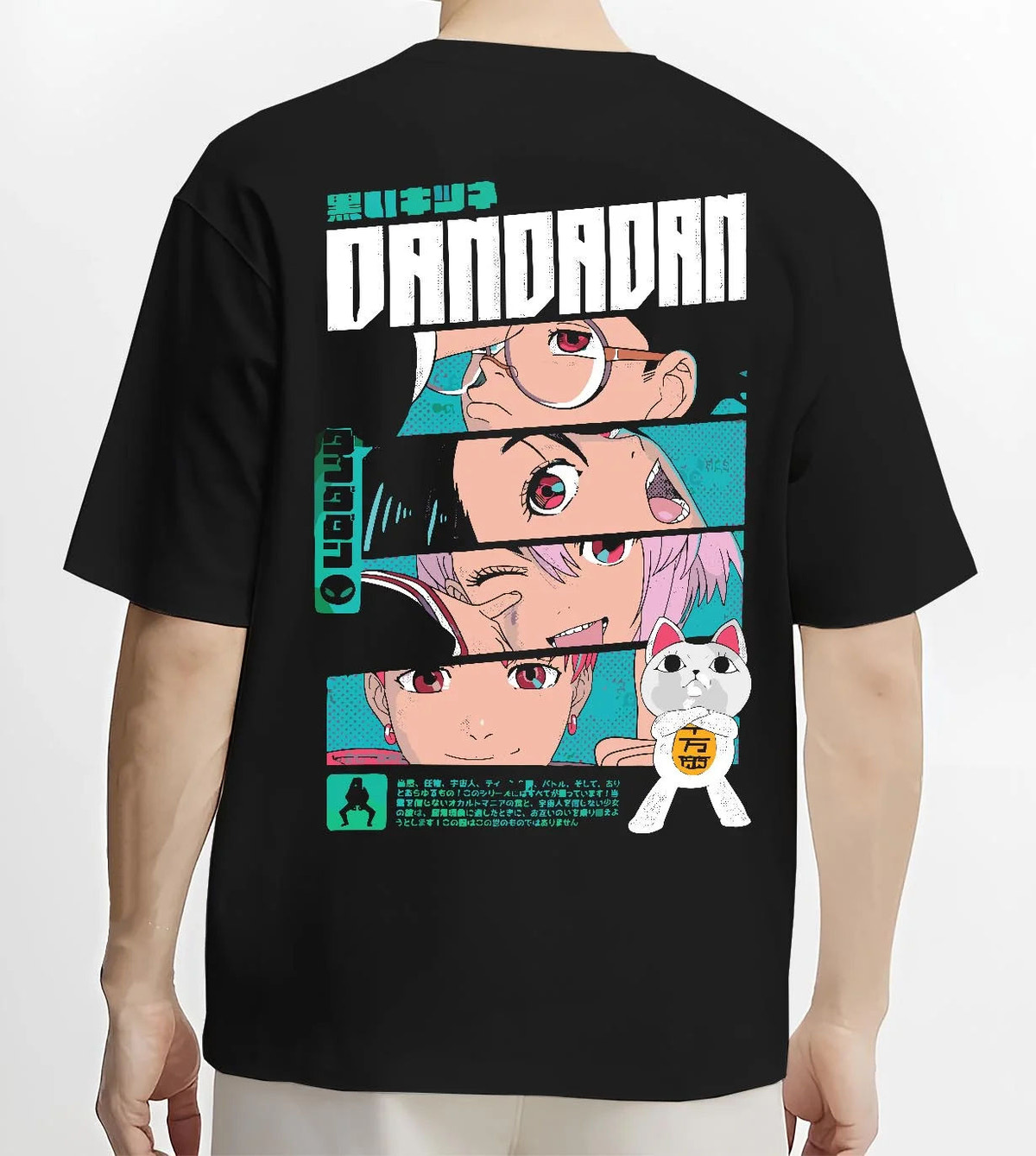 Black T-shirt model back view showing Dandadan ensemble: Okarun, Momo, Aira, Jiji and Turbo Granny (cat)