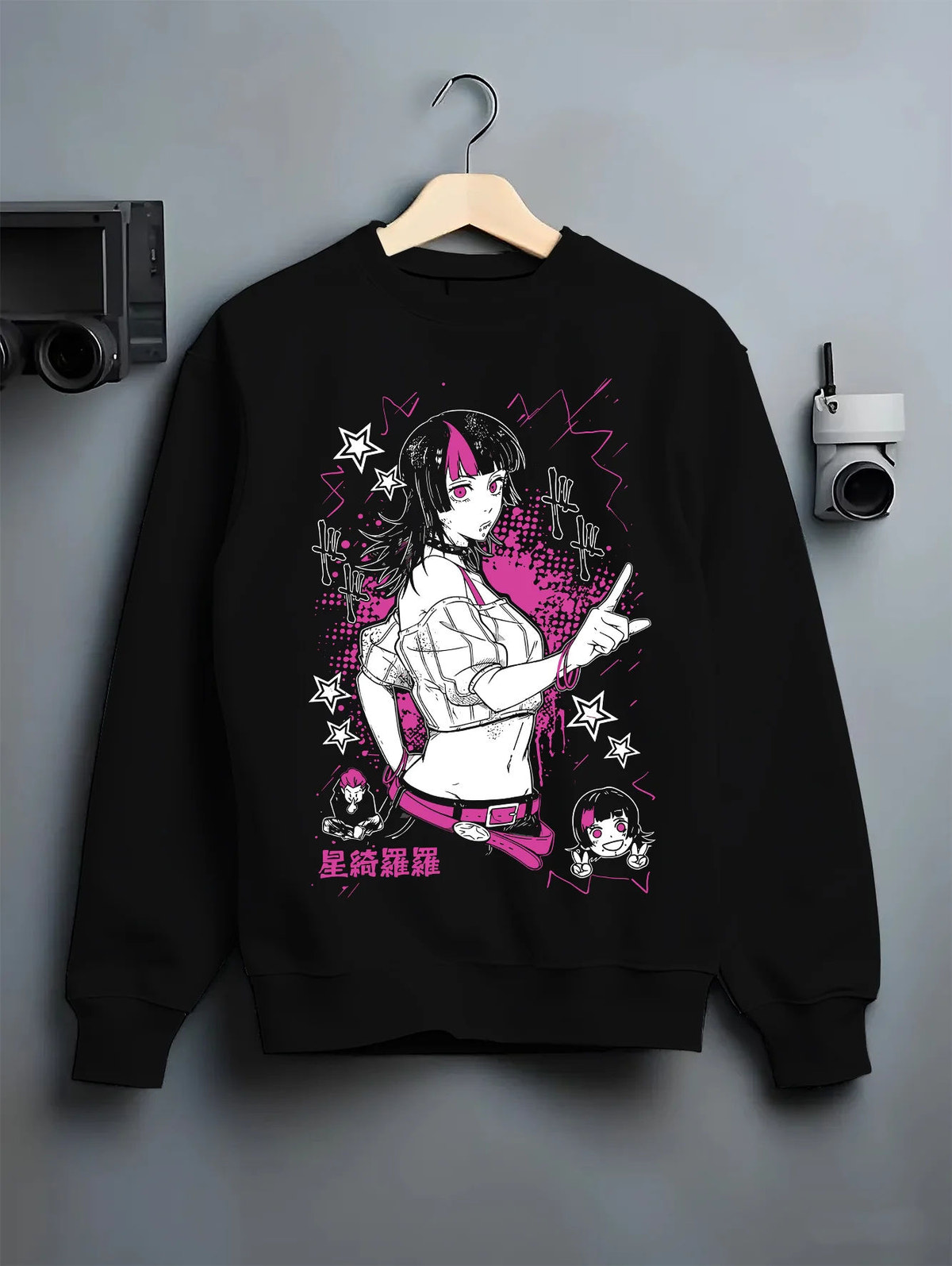 Black crewneck sweatshirt on hanger with Kirara Hoshi with star motif from Jujutsu Kaisen illustrated back graphic
