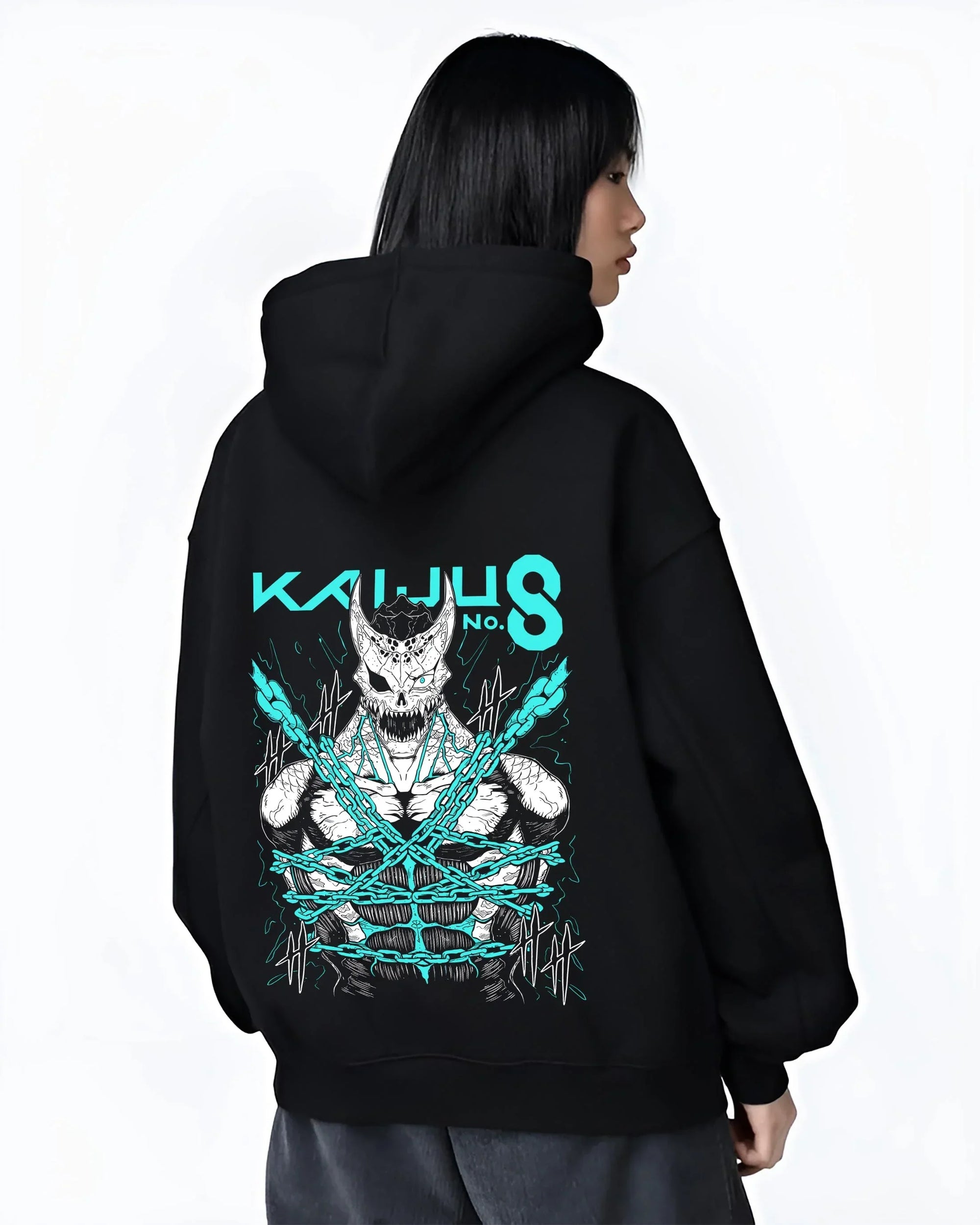 Black hoodie worn by female model, back view with Kaiju No. 8 Hoodie Kaiju Battle Transformation Form graphic streetwear graphic.