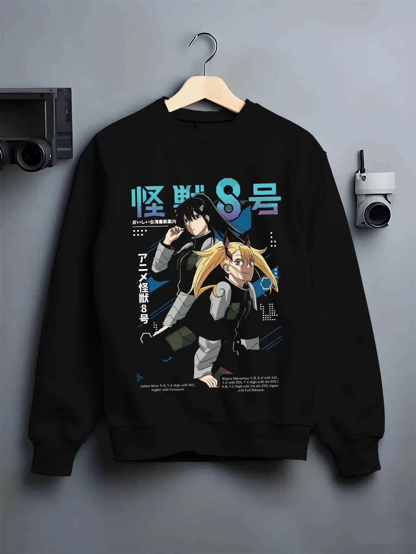 Black crewneck sweatshirt on hanger with Kaiju No. 8 Hoodie Defense Force Team Stance graphic premium wear.