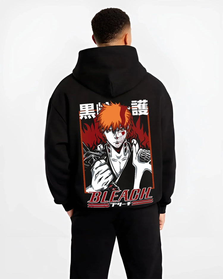 Black hoodie worn by male model, back view with Ichigo Bankai Battle Hoodie Bleach Anime Soul Reaper graphic bold anime graphic.