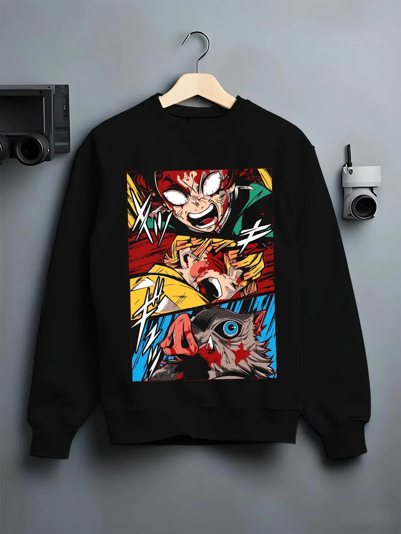 Black crewneck sweatshirt on hanger with Kimetsu no Yaiba Hoodie Corps Battle Blood Clash graphic bold anime graphic.