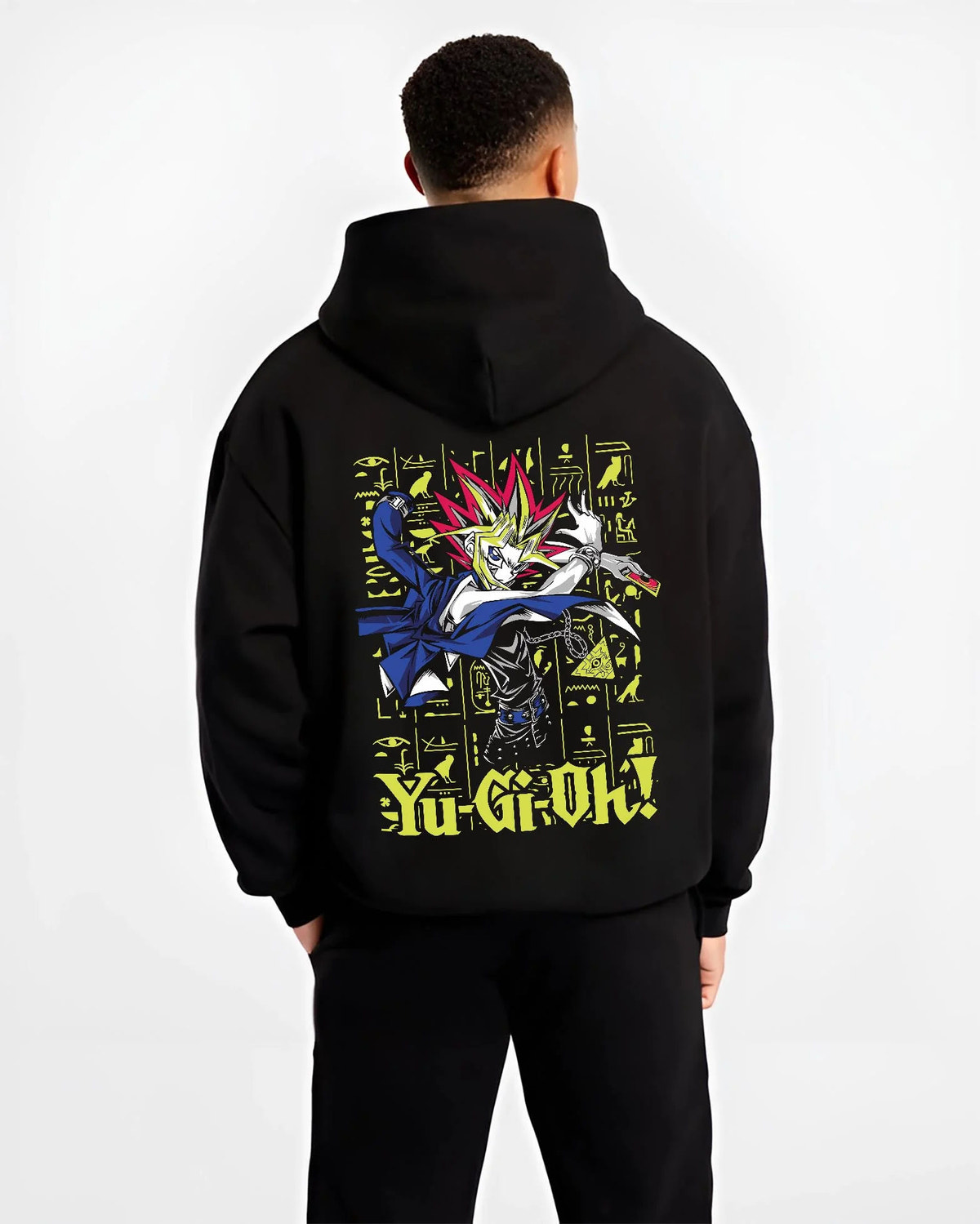 Black hoodie worn by male model from the back featuring Yugi King of Games Millennium Puzzle artwork.