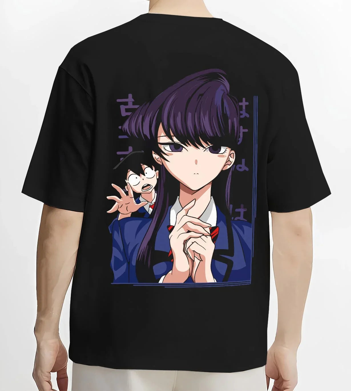 Black T-shirt worn by male model, back view with Komi Can’t Communicate Hoodie Shouko Komi School Uniform graphic bold anime graphic.