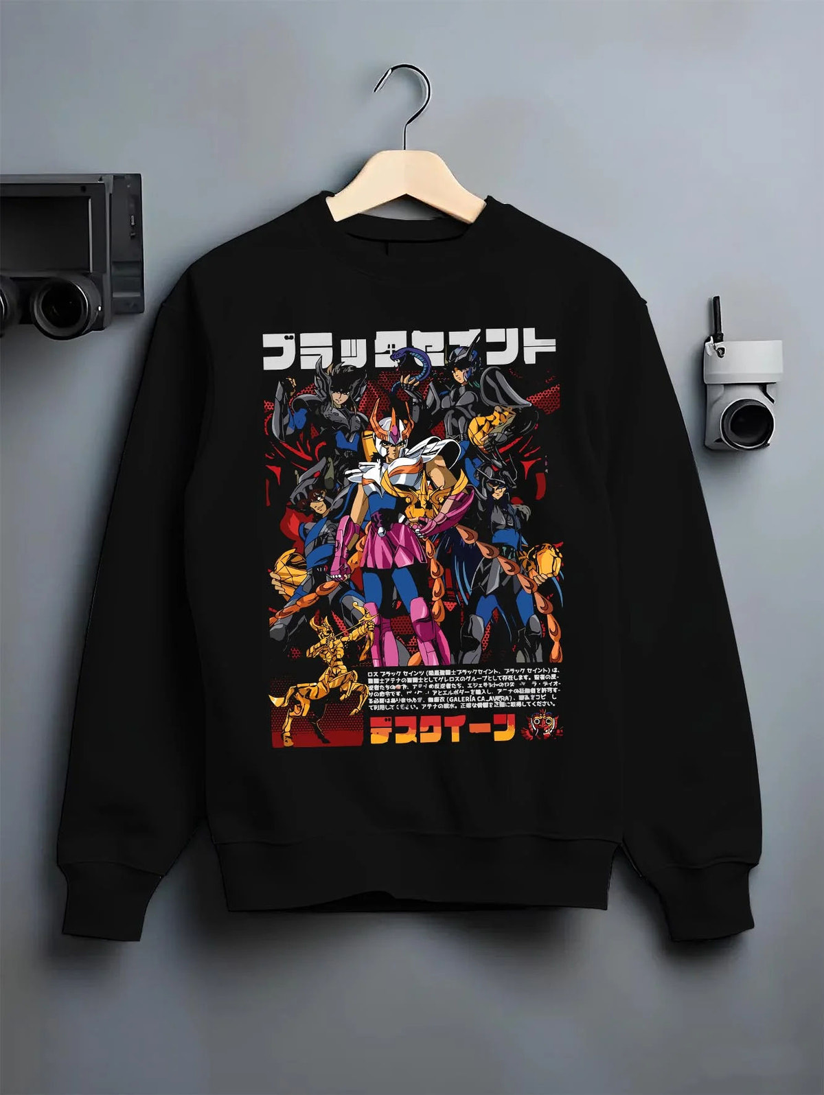 Black crewneck sweatshirt on hanger featuring Saint Seiya Bronze Saints zodiac warriors artwork.