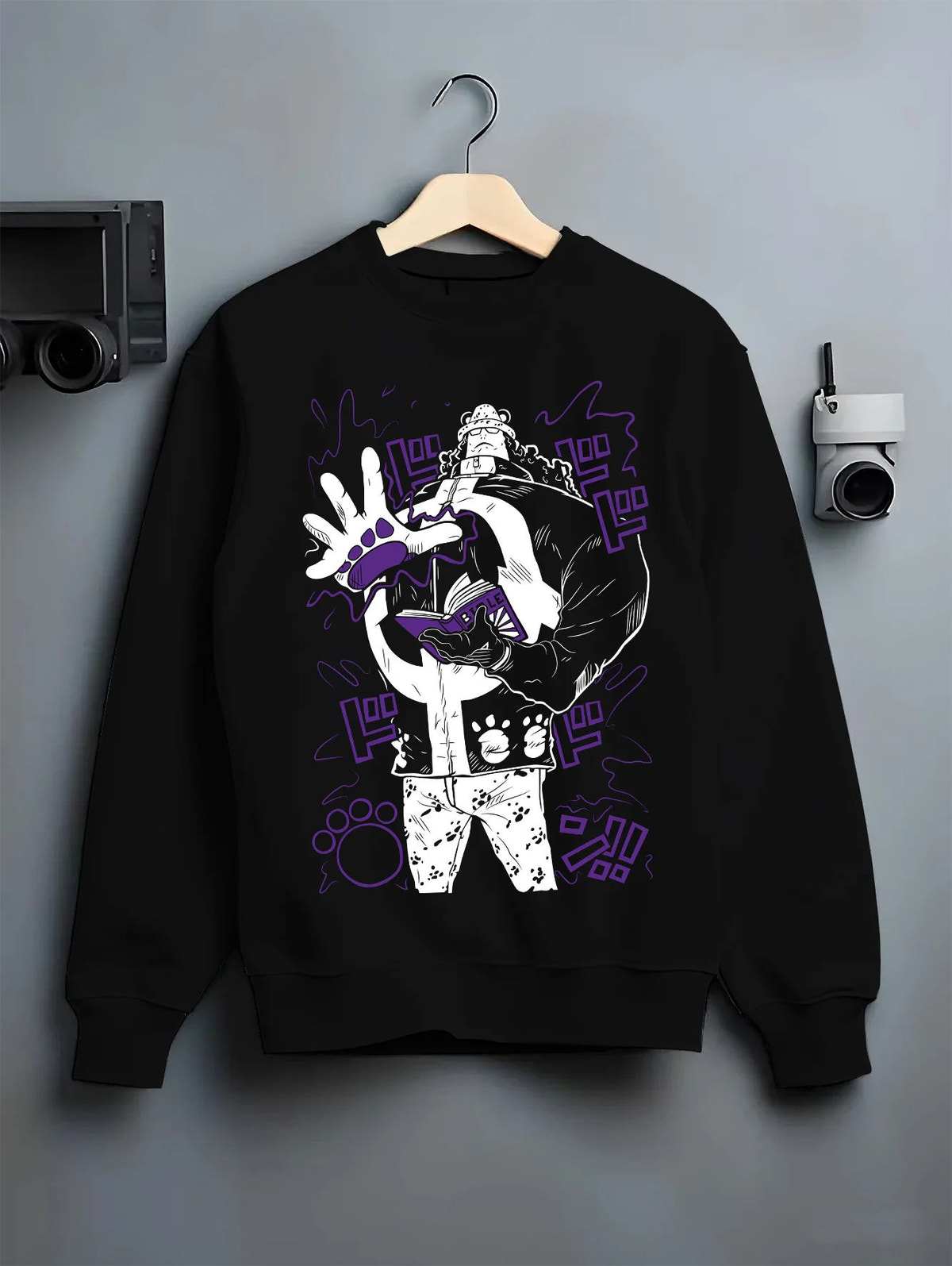Black crewneck sweatshirt on hanger showing Bartholomew Kuma from One Piece: paw-paw fruit