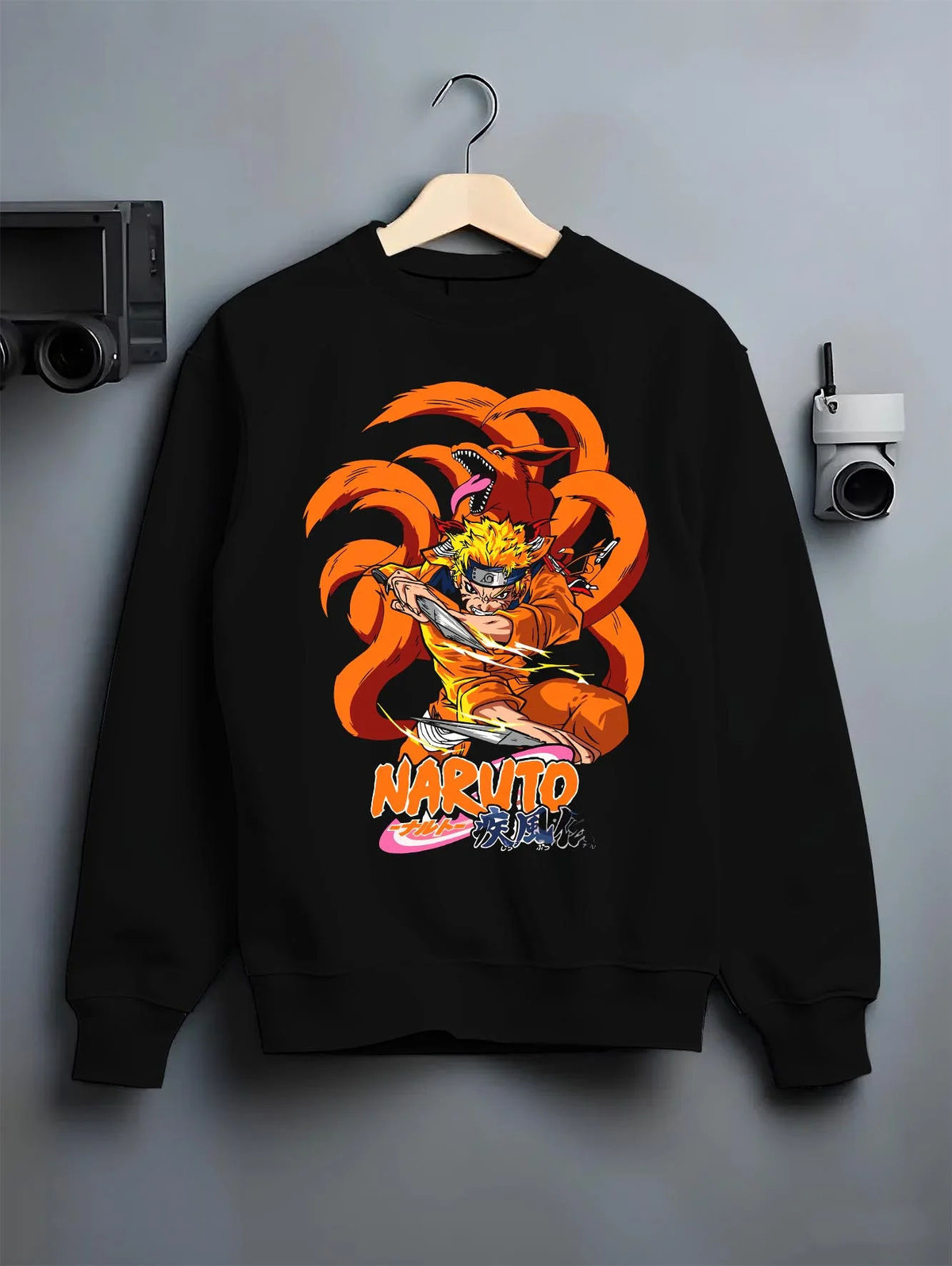 Black crewneck sweatshirt on hanger featuring Naruto Kurama Nine Tails chakra artwork.