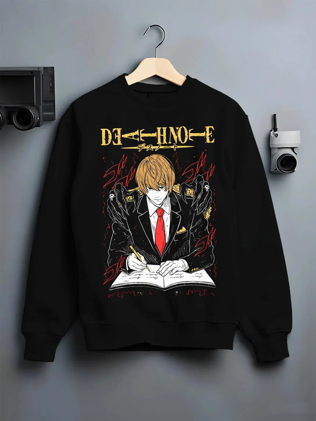 Black crewneck sweatshirt on hanger with Light Yagami Hoodie Death Note Kira Retro Villain graphic streetwear graphic.