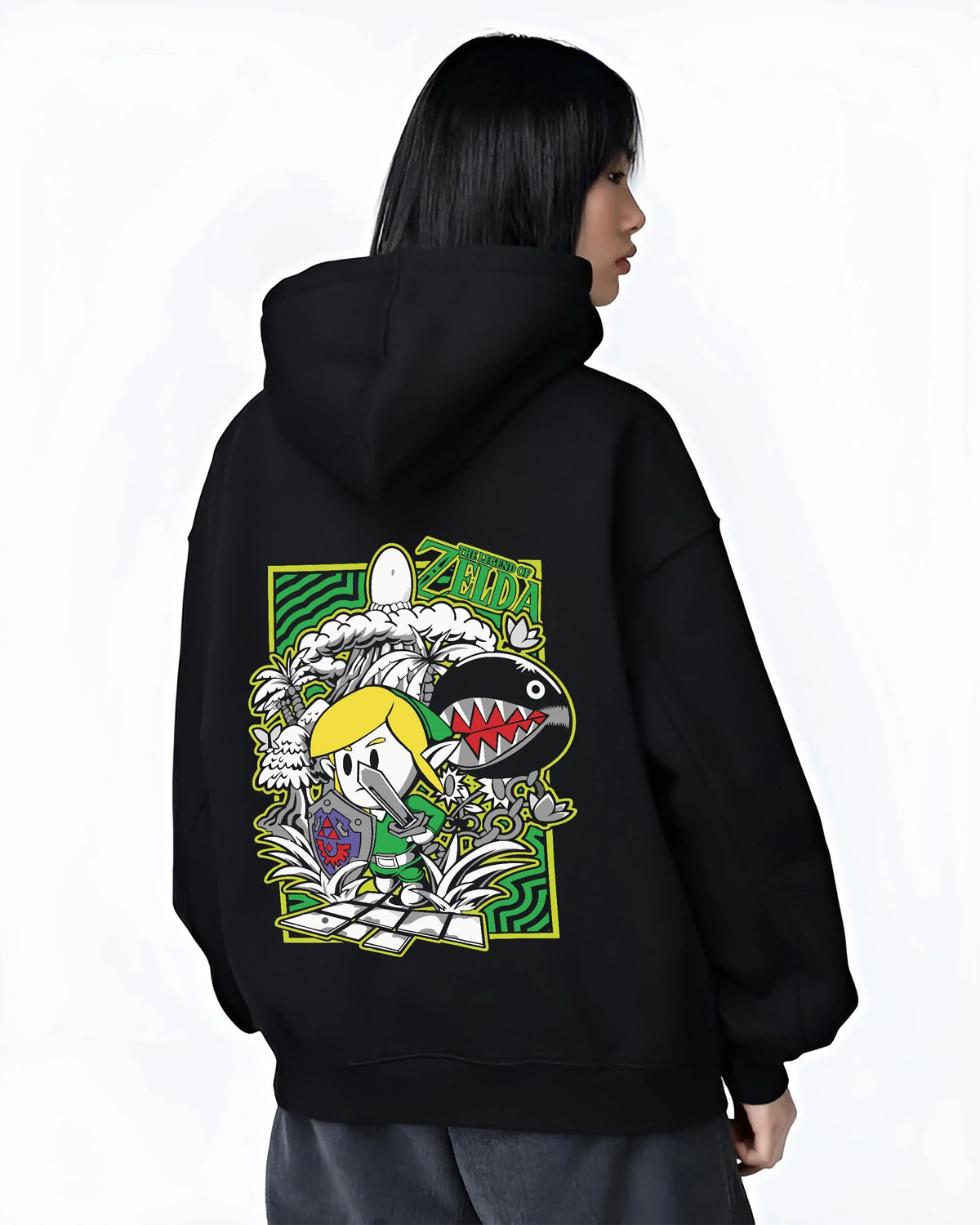 Black hoodie worn by female model from the back featuring Link with the Master Sword artwork.