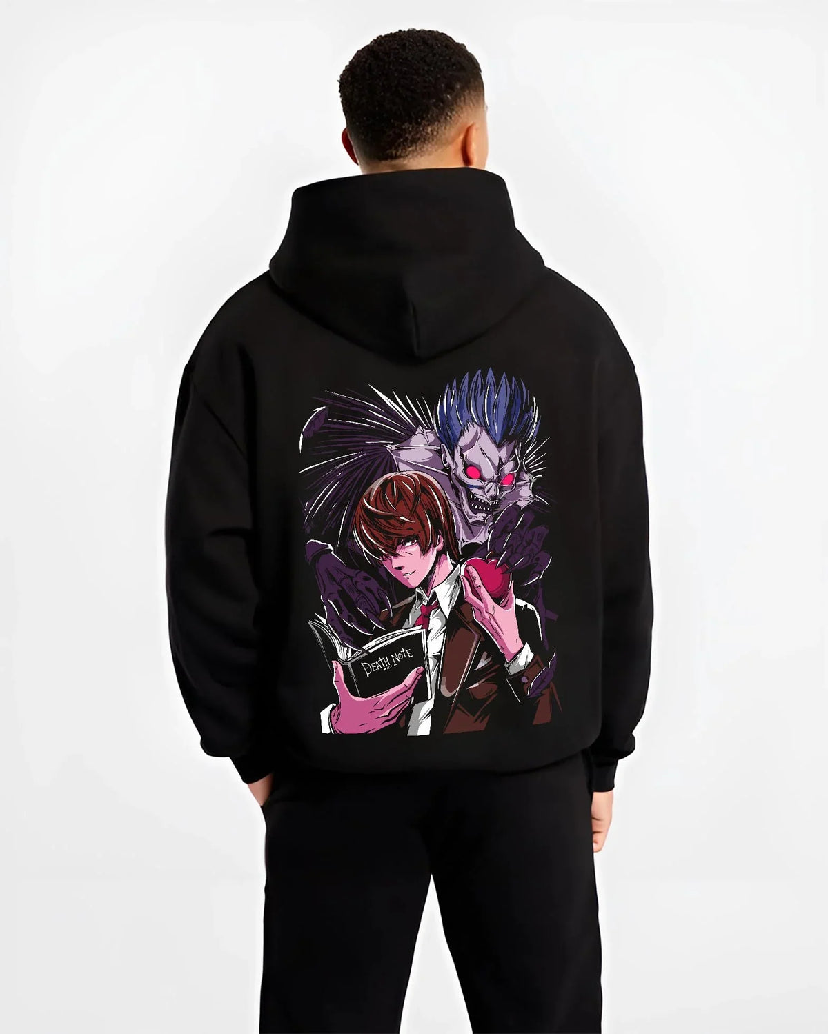 Black hoodie worn by male model, back view with Ryuk Hoodie Death Note Shinigami Dark Aesthetic graphic premium wear.