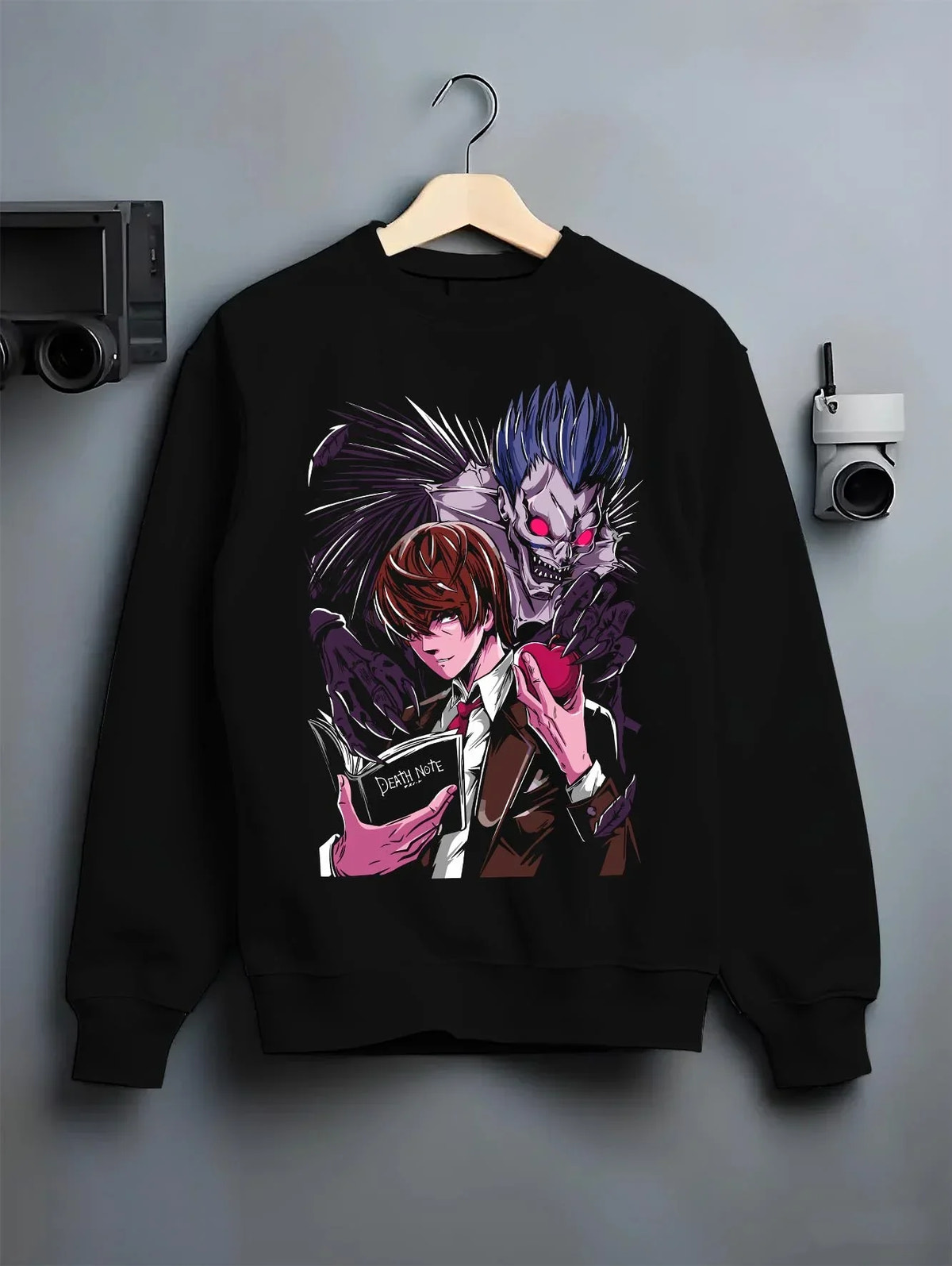 Black crewneck sweatshirt on hanger with Ryuk Hoodie Death Note Shinigami Dark Aesthetic graphic bold anime graphic.