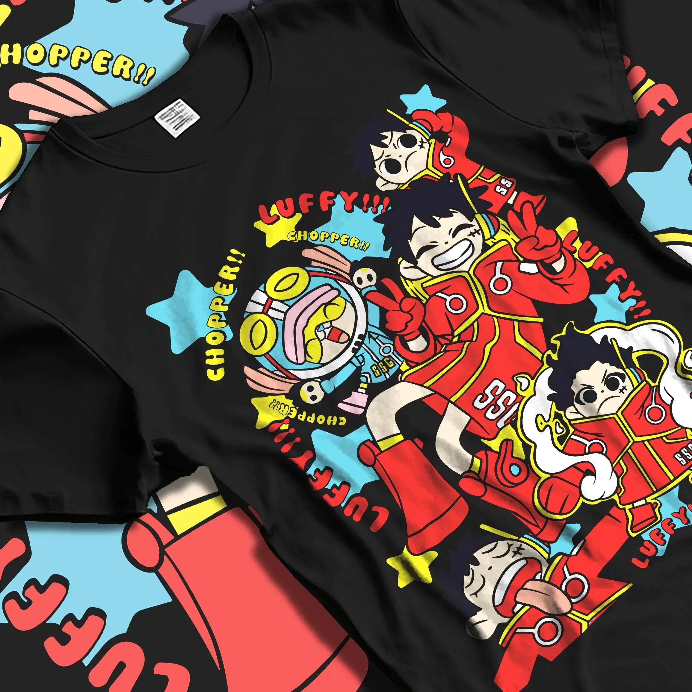 Black T-shirt laid flat with natural folds displaying vibrant retro streetwear graphic of Luffy and Chopper from One Piece anime.