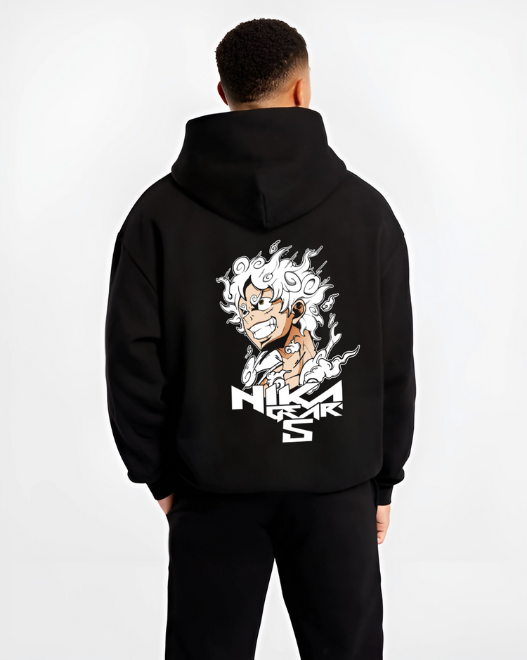Black hoodie worn by a male model, back view, featuring One Piece Luffy Gear 5 shonen battle streetwear artwork.