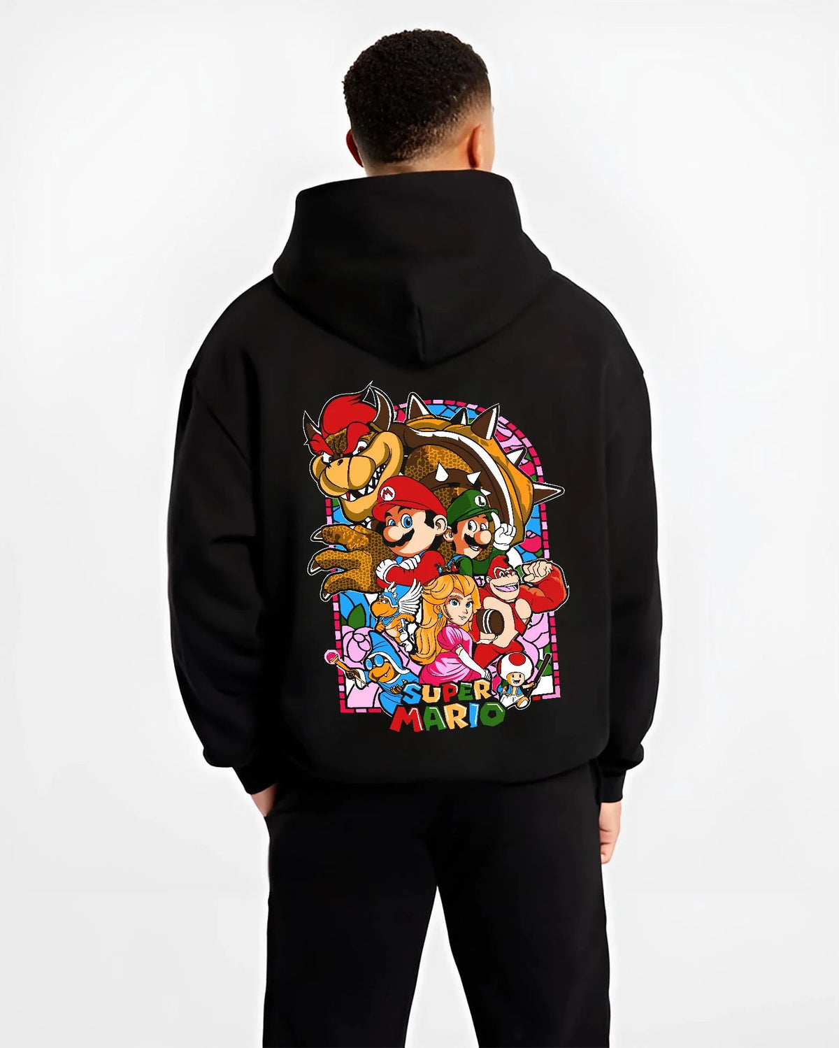 Black hoodie worn by male model from the back featuring Mario and the Mushroom Kingdom cast artwork.