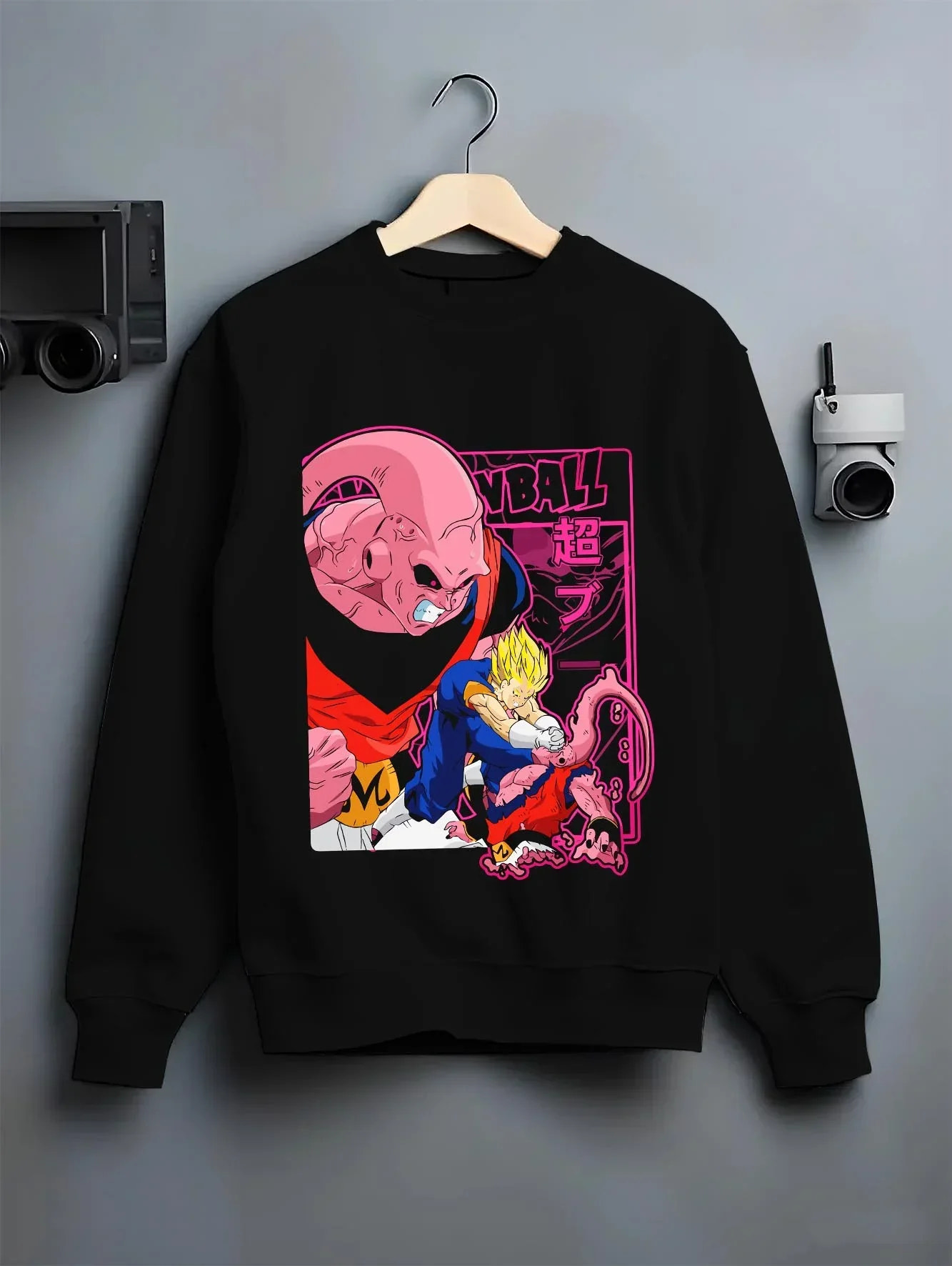 Black crewneck sweatshirt on hanger with Majin Buu Hoodie Dragon Ball Z Evil Form graphic streetwear graphic.