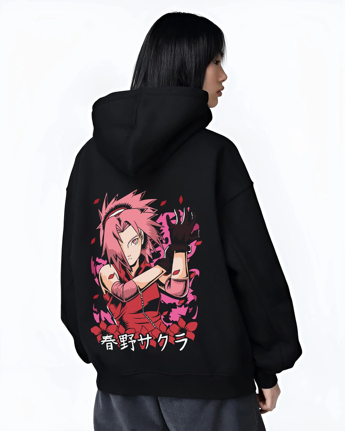 Black hoodie worn by female model from the back featuring Sakura Haruno medical ninja strength artwork.