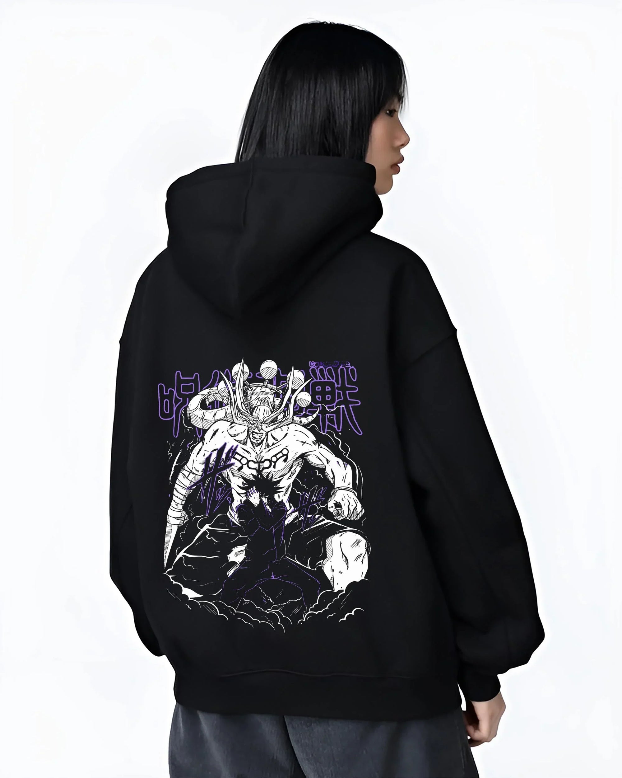 Black hoodie worn by female model, back view, featuring Japanese animation streetwear print of Mahoraga Shikigami battle scene with Megumi.