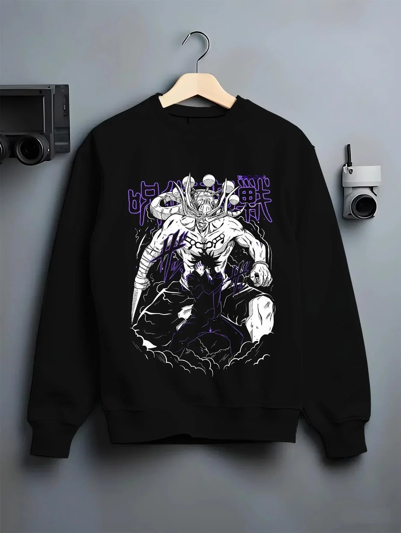 Black crewneck sweatshirt on hanger, featuring retro streetwear graphic of Mahoraga and Megumi Shikigami design.