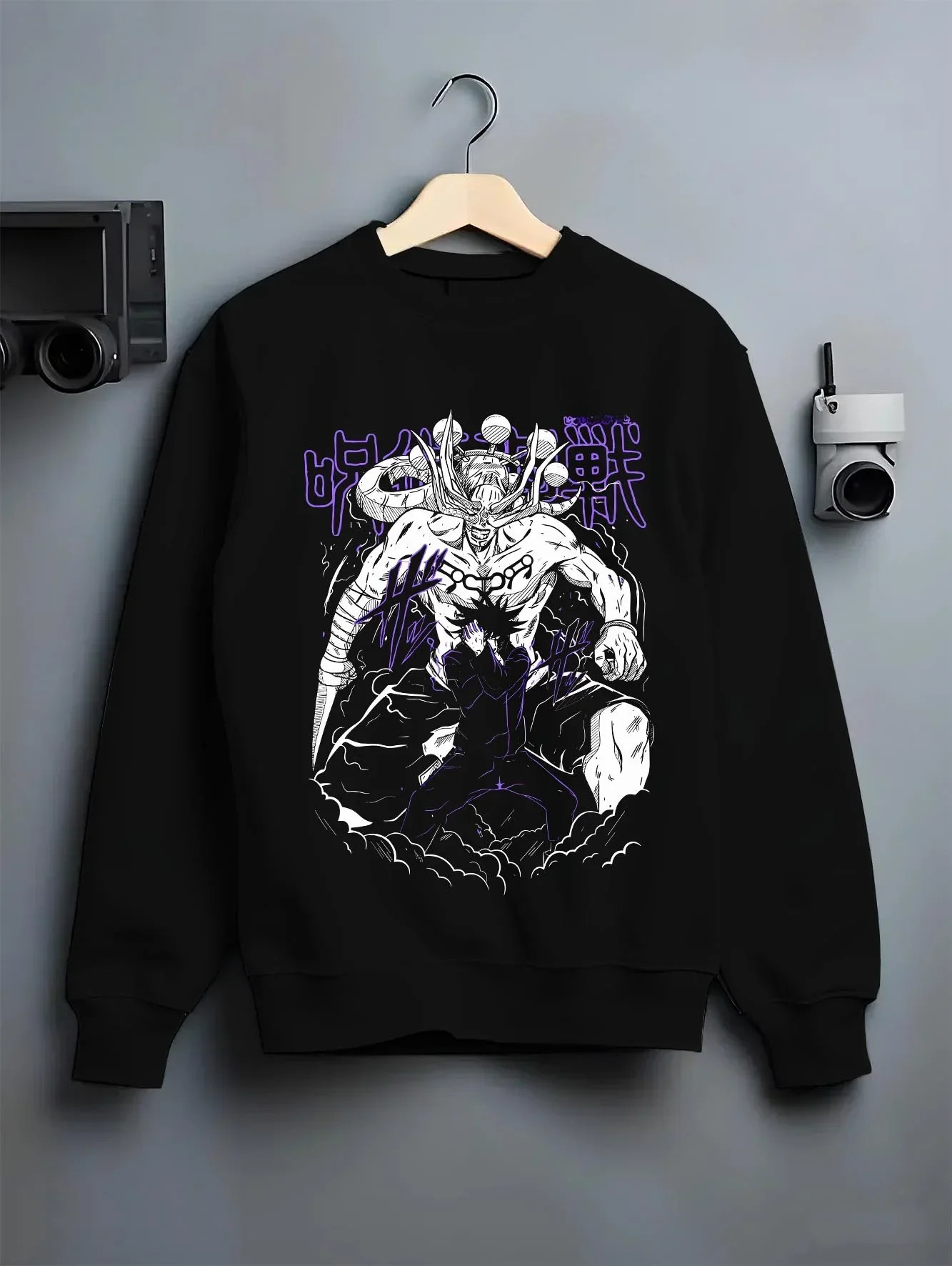 Black crewneck sweatshirt on hanger, featuring retro streetwear graphic of Mahoraga and Megumi Shikigami design.