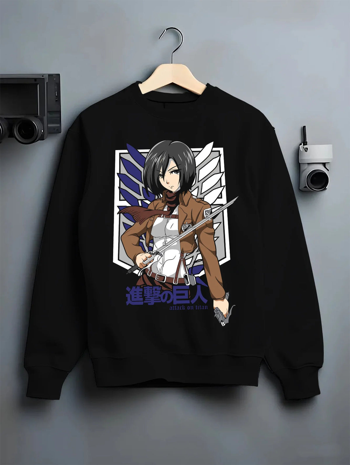 Black crewneck sweatshirt on hanger showing Mikasa Ackerman from Attack on Titan: Survey Corps swords