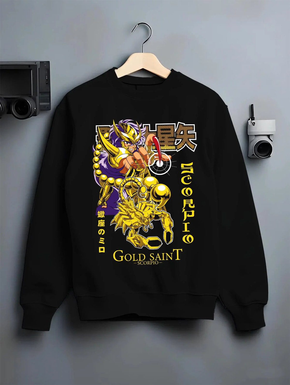 Black crewneck sweatshirt on hanger featuring Scorpio Milo Gold Saint artwork.