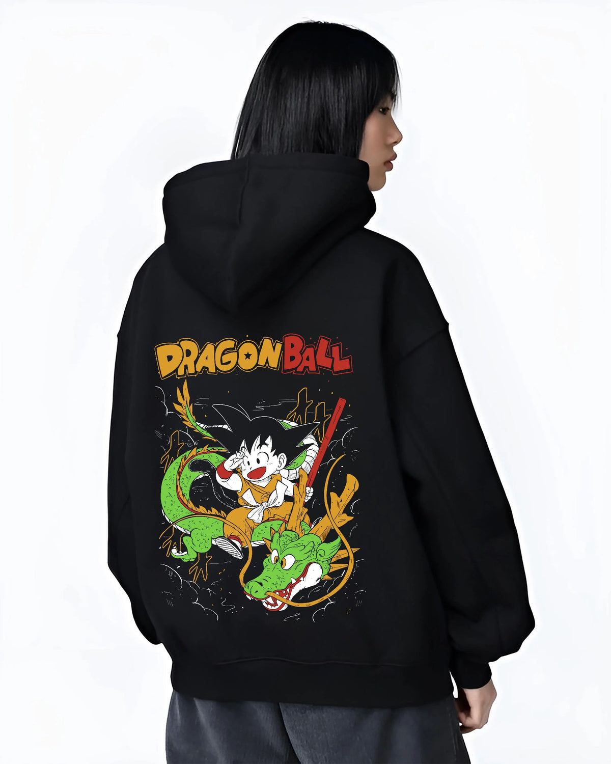 Black hoodie worn by female model from the back featuring Kid Goku and Shenron artwork.