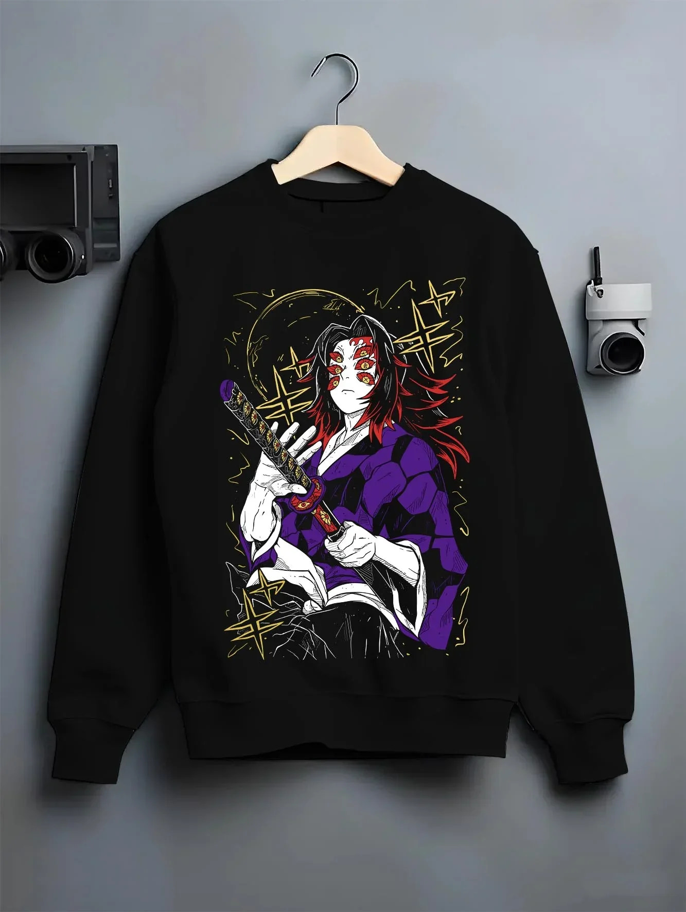Black crewneck sweatshirt on hanger with Kokushibo Hoodie Demon Slayer Blood Moon Blade graphic premium wear.