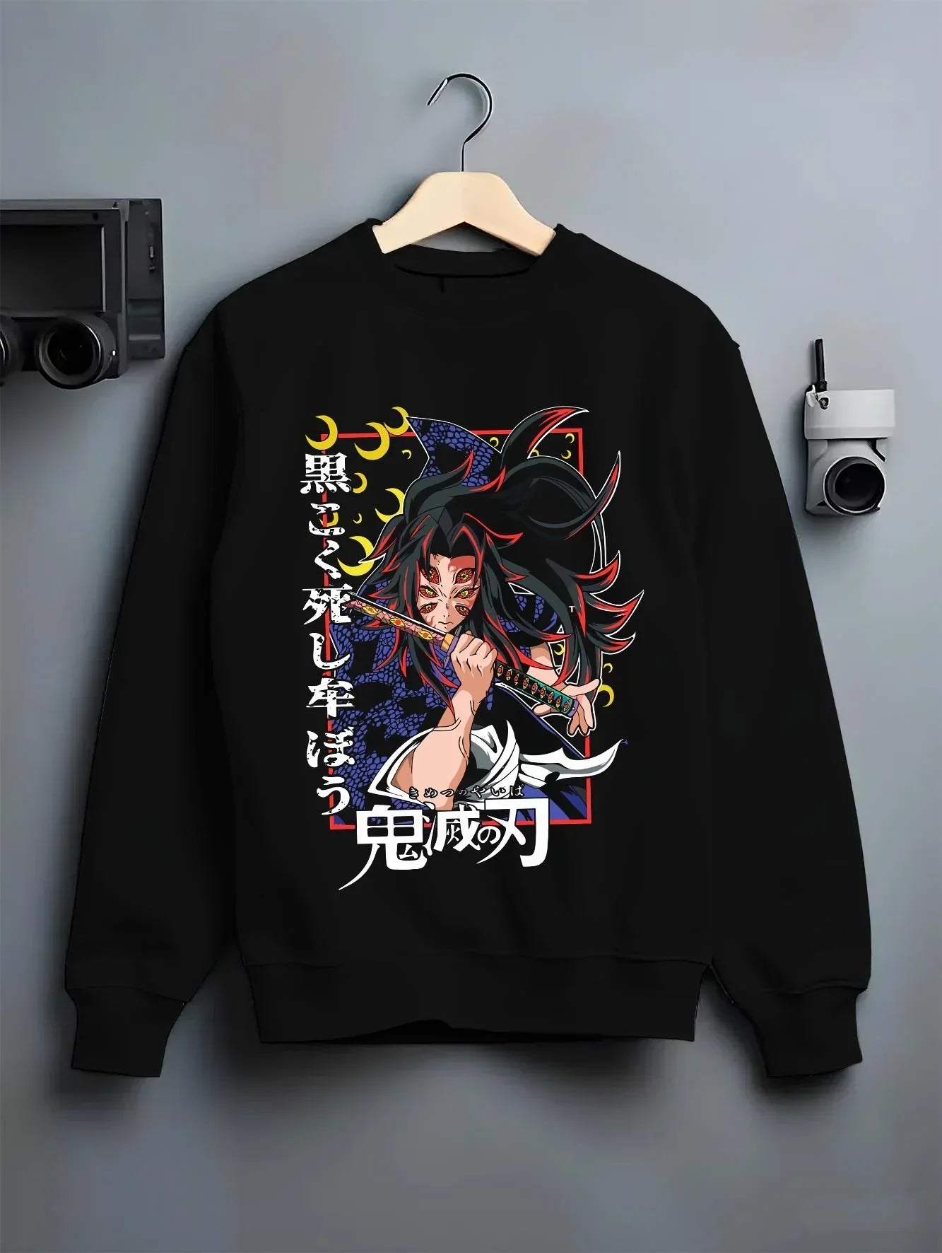 Black crewneck sweatshirt on hanger with Kokushibo Hoodie Demon Slayer Tragic Moon Form graphic streetwear graphic.