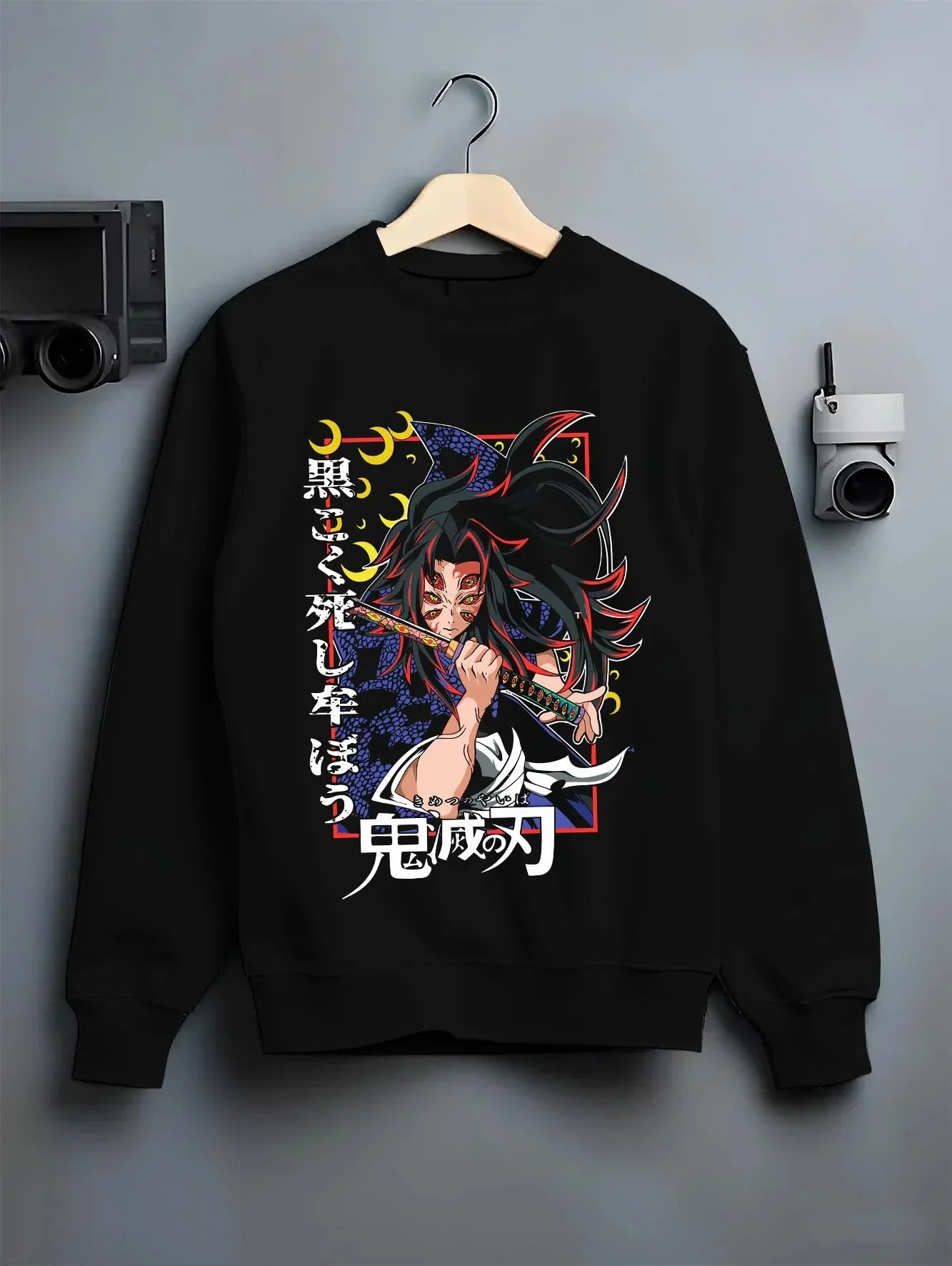 Black crewneck sweatshirt on hanger with Kokushibo Hoodie Demon Slayer Tragic Moon Form graphic streetwear graphic.