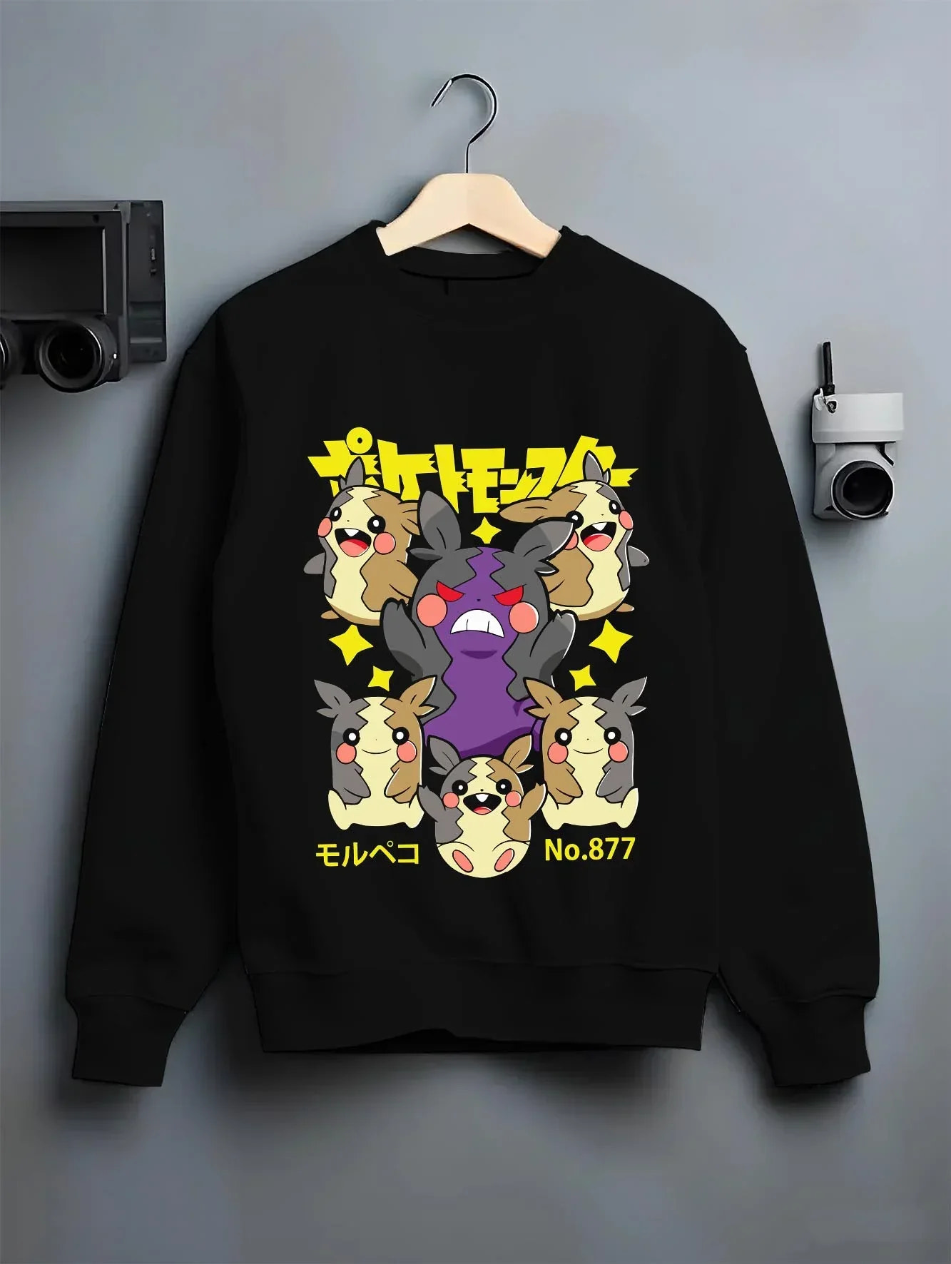 Black crewneck sweatshirt on hanger with Morpeko Hoodie Pokémon Character Evolution graphic premium wear.