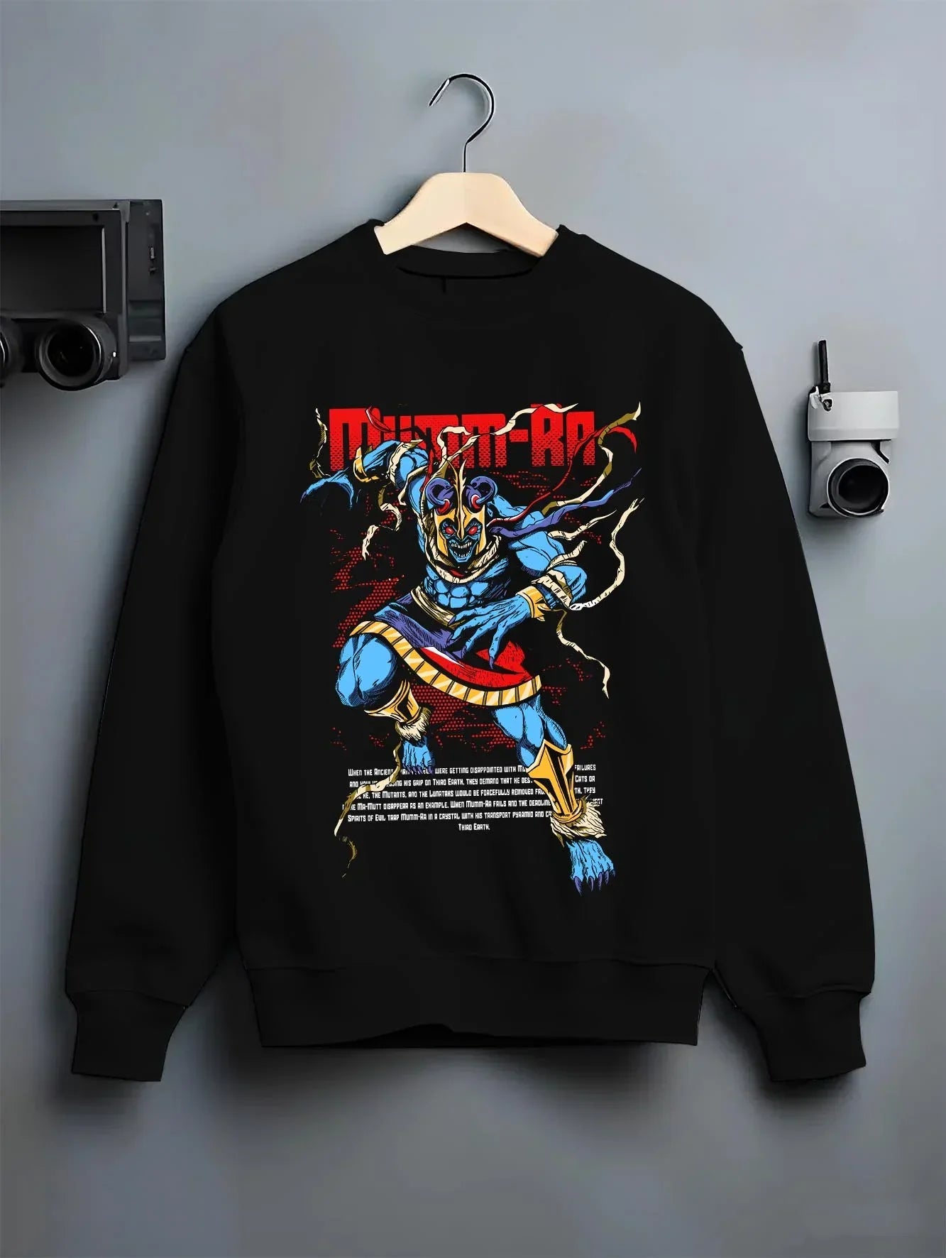 Black crewneck sweatshirt on hanger with Mumm-Ra Hoodie Thundercats Ancient Evil Power graphic bold anime graphic.
