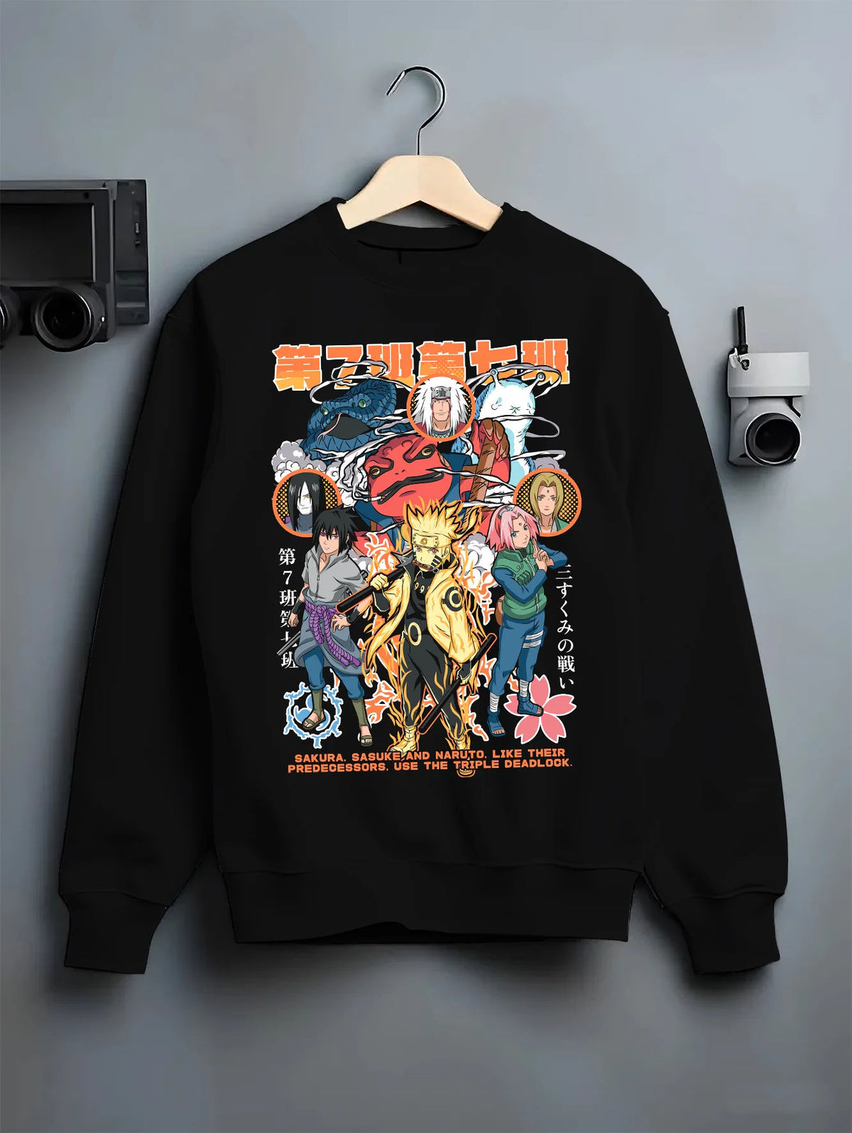 Black crewneck sweatshirt on hanger with Naruto / Sasuke and Naruto cast manga montage illustrated back graphic