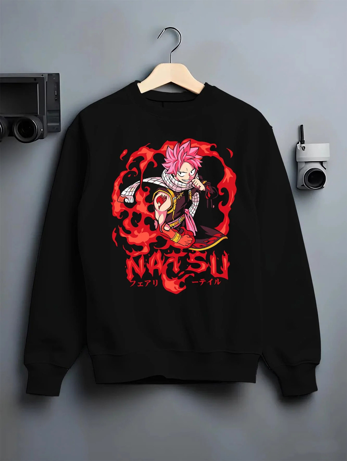 Black crewneck sweatshirt on hanger featuring Natsu Dragneel Fire Dragon Slayer artwork.