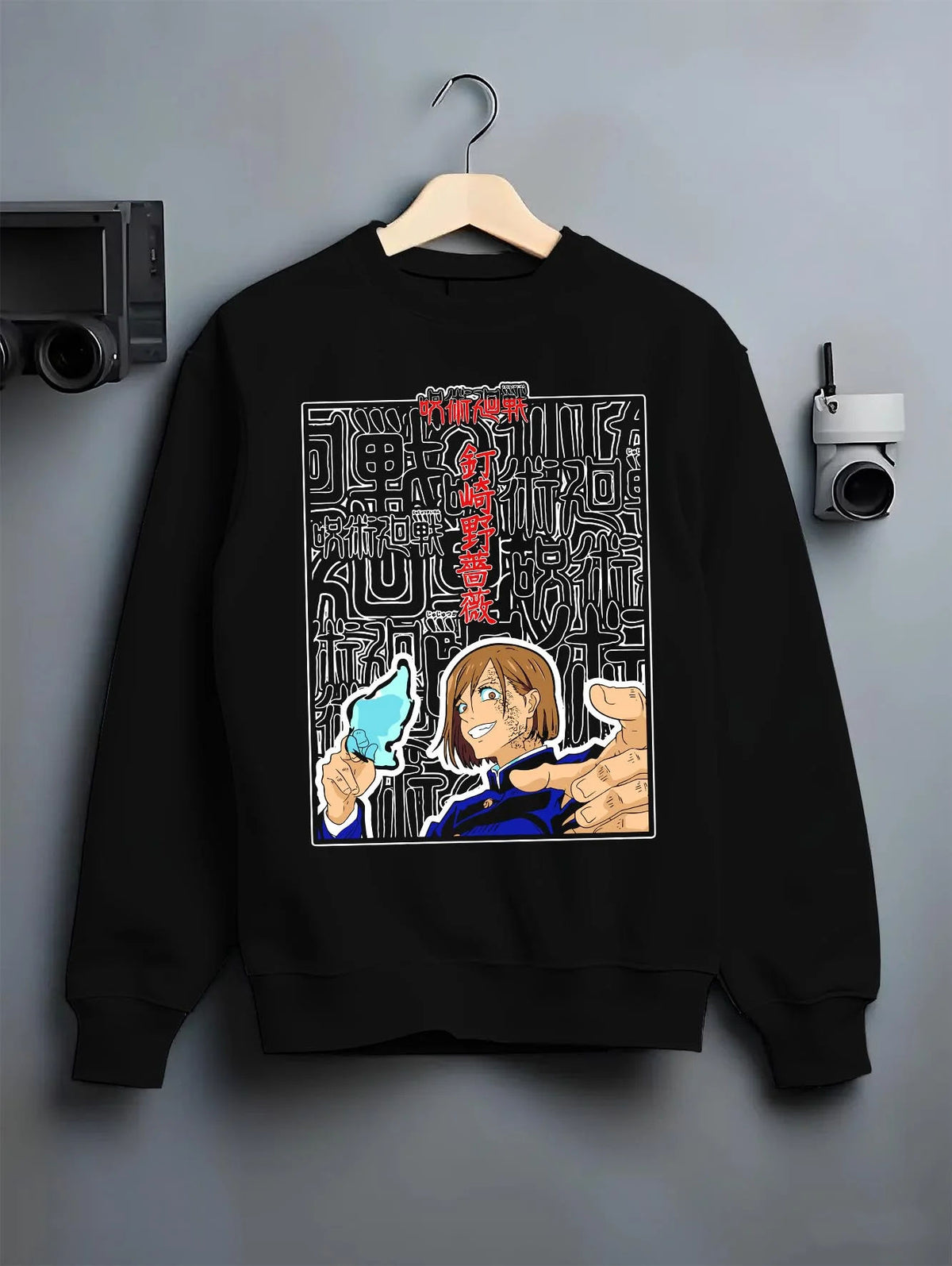 Black crewneck sweatshirt on hanger featuring Nobara Kugisaki Straw Doll Technique artwork.