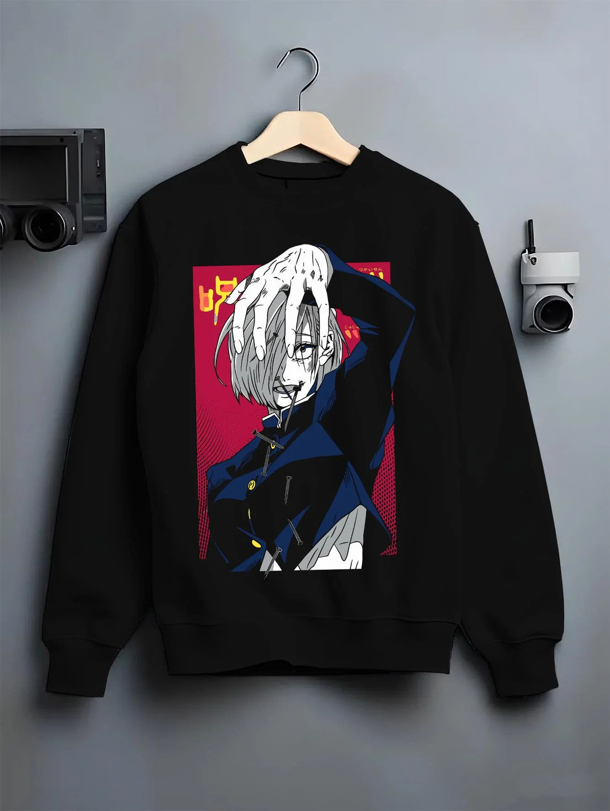 Black crewneck sweatshirt on hanger featuring Nobara Kugisaki cursed nails artwork.