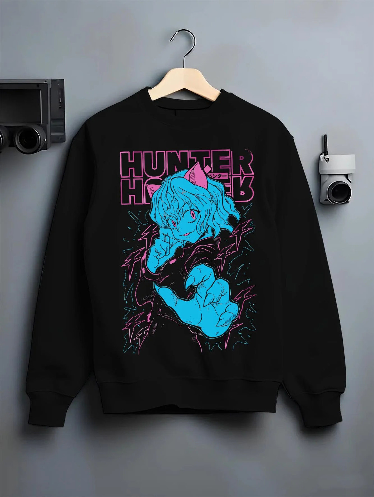 Black crewneck sweatshirt on hanger featuring Neferpitou Chimera Ant aura artwork.