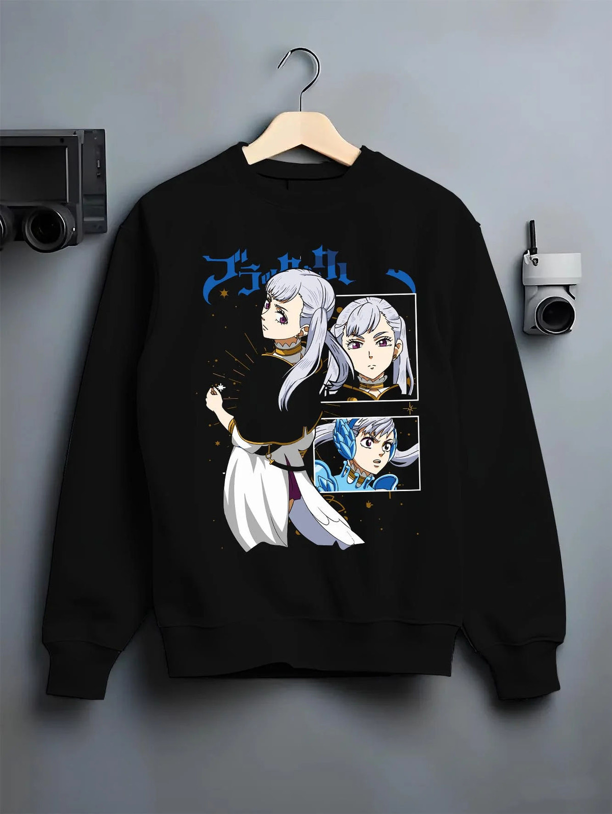 Black crewneck sweatshirt on hanger featuring Noelle Silva water magic artwork.