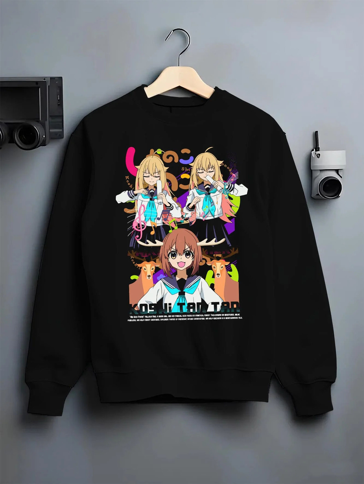 Black crewneck sweatshirt on hanger featuring Nokotan and the Deer Club group artwork.