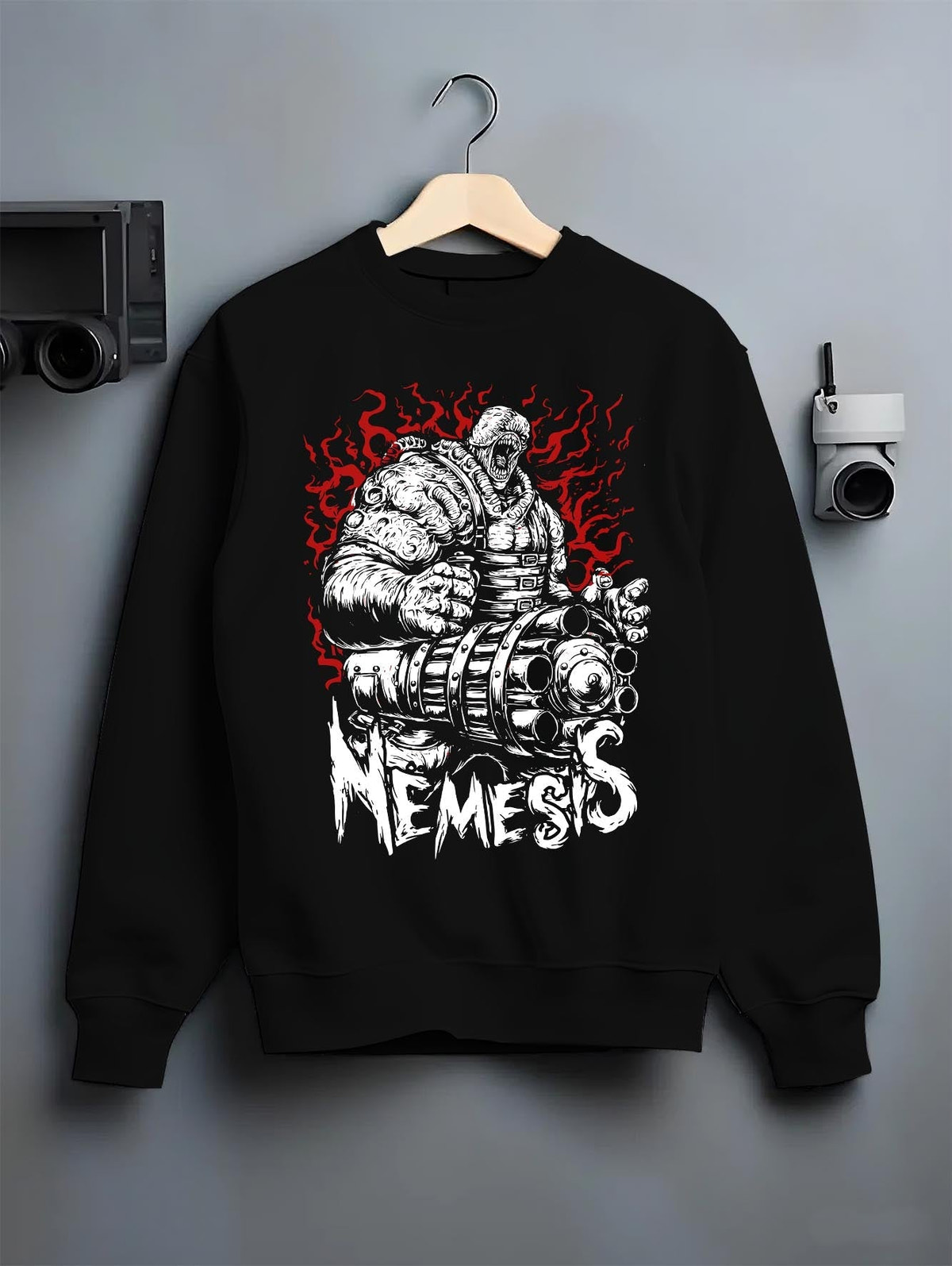 Black crewneck sweatshirt on a hanger against a grey wall, featuring Nemesis Resident Evil neo-noir horror villain artwork with retro streetwear aesthetic.