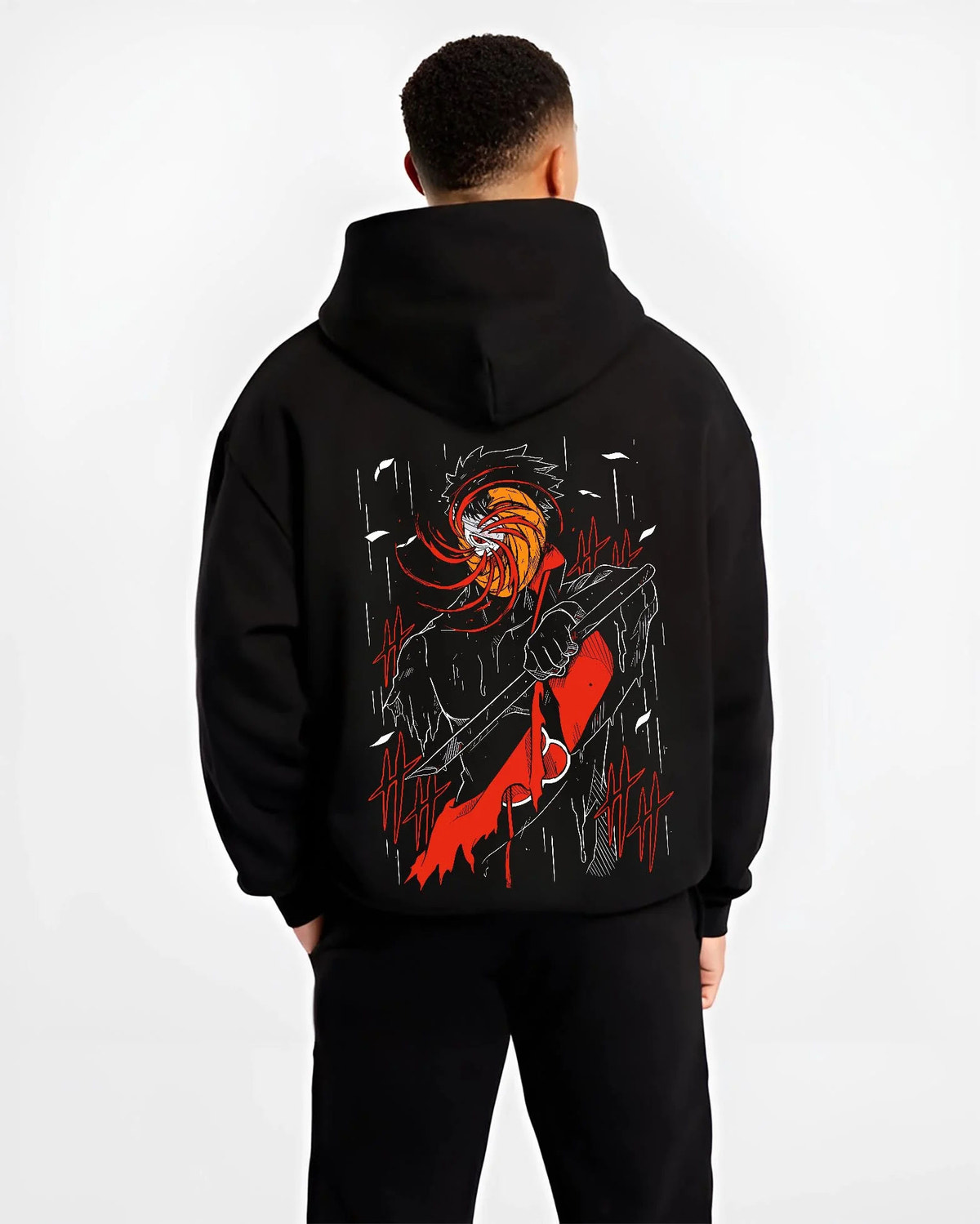Black hoodie worn by male model from the back featuring Obito Uchiha Akatsuki spiral mask Naruto artwork.