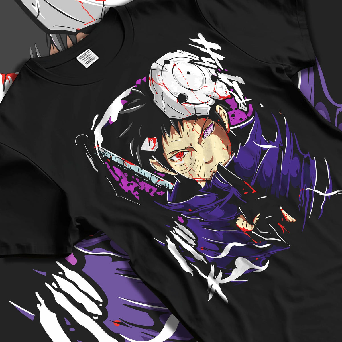 Black T-shirt laid flat with natural folds featuring Obito Uchiha Sharingan Rinnegan mask Naruto artwork.