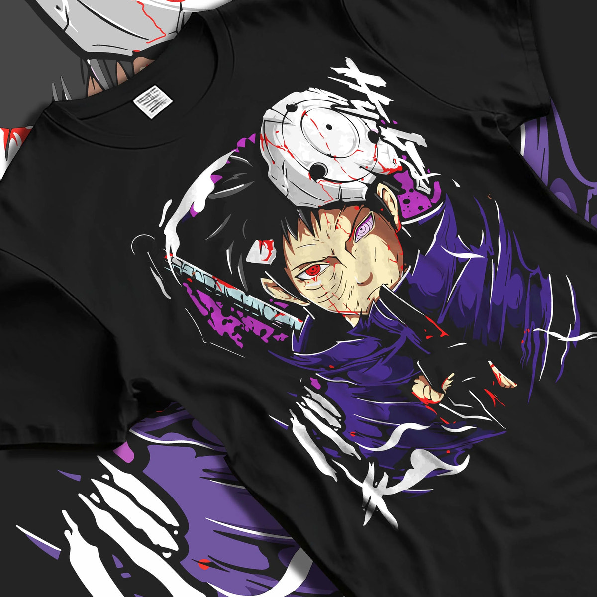 Black T-shirt laid flat with natural folds featuring Obito Uchiha Sharingan Rinnegan mask Naruto artwork.