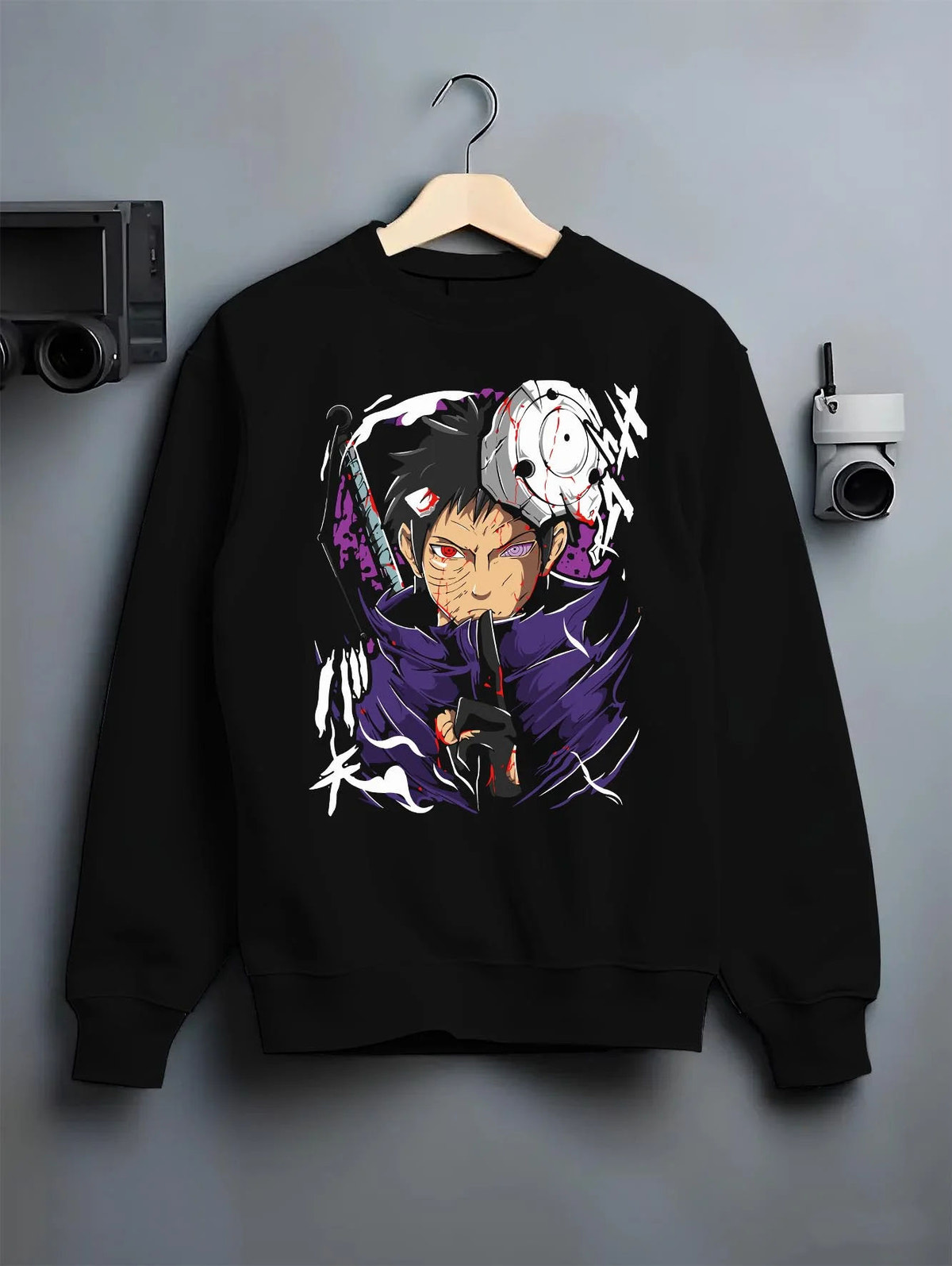 Black crewneck sweatshirt on hanger featuring Obito Uchiha Sharingan Rinnegan mask Naruto artwork.