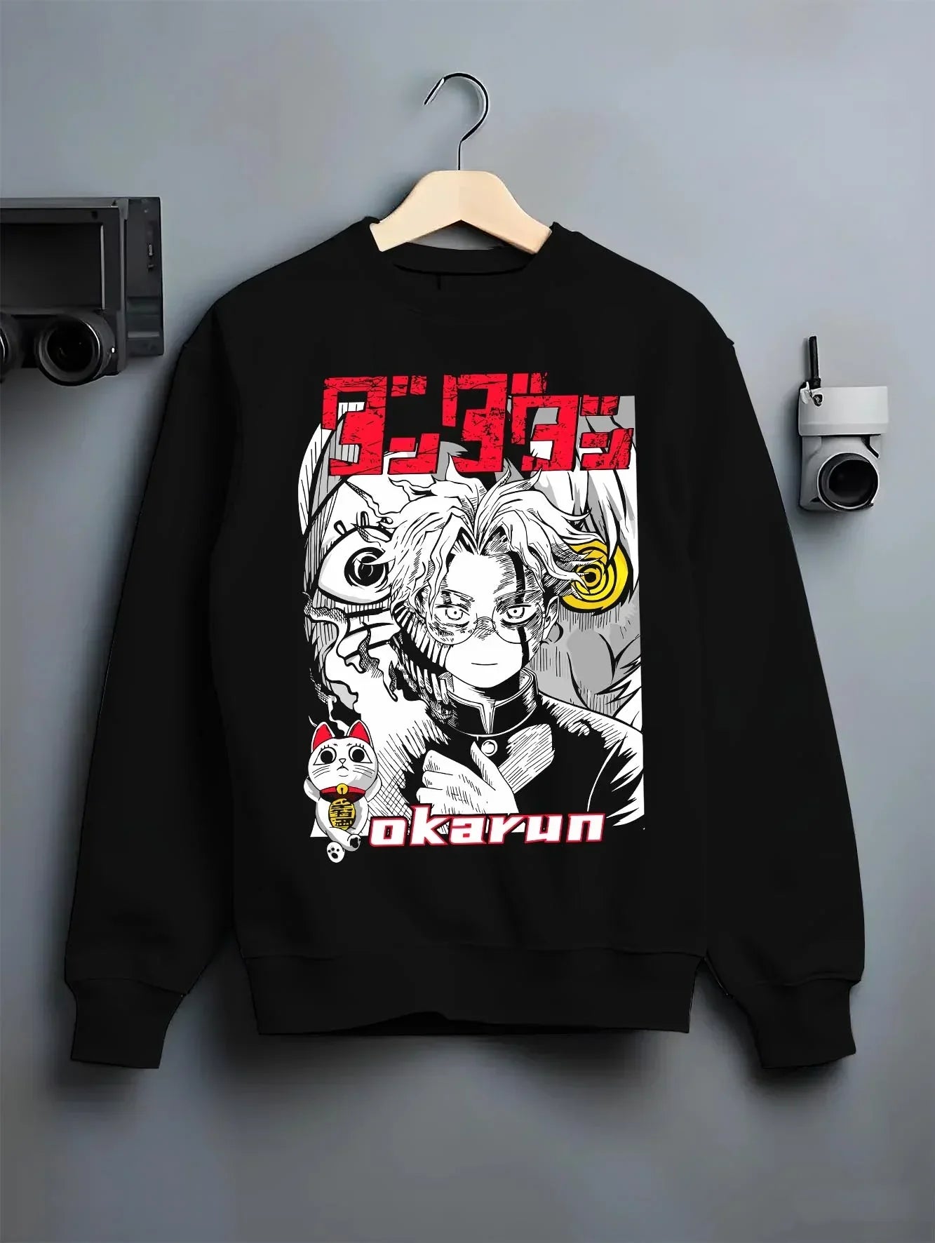 Black crewneck sweatshirt on hanger with Okarun Hoodie Dandadan Paranormal Occult Fighter graphic Okarun anime design.