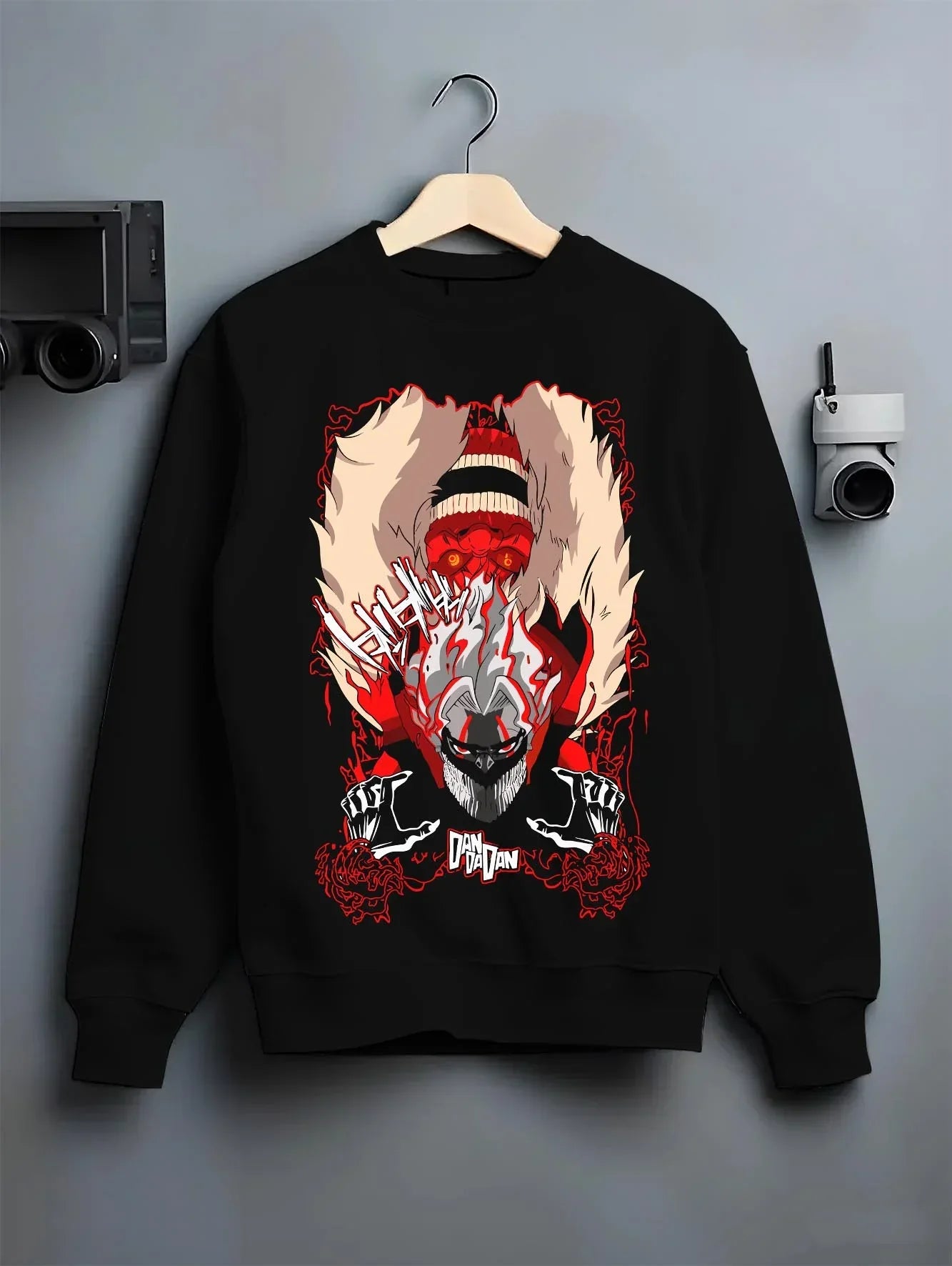 Black crewneck sweatshirt on hanger with Turbo Granny Dandadan Hoodie Retro Yokai Anime Horror graphic bold anime graphic.