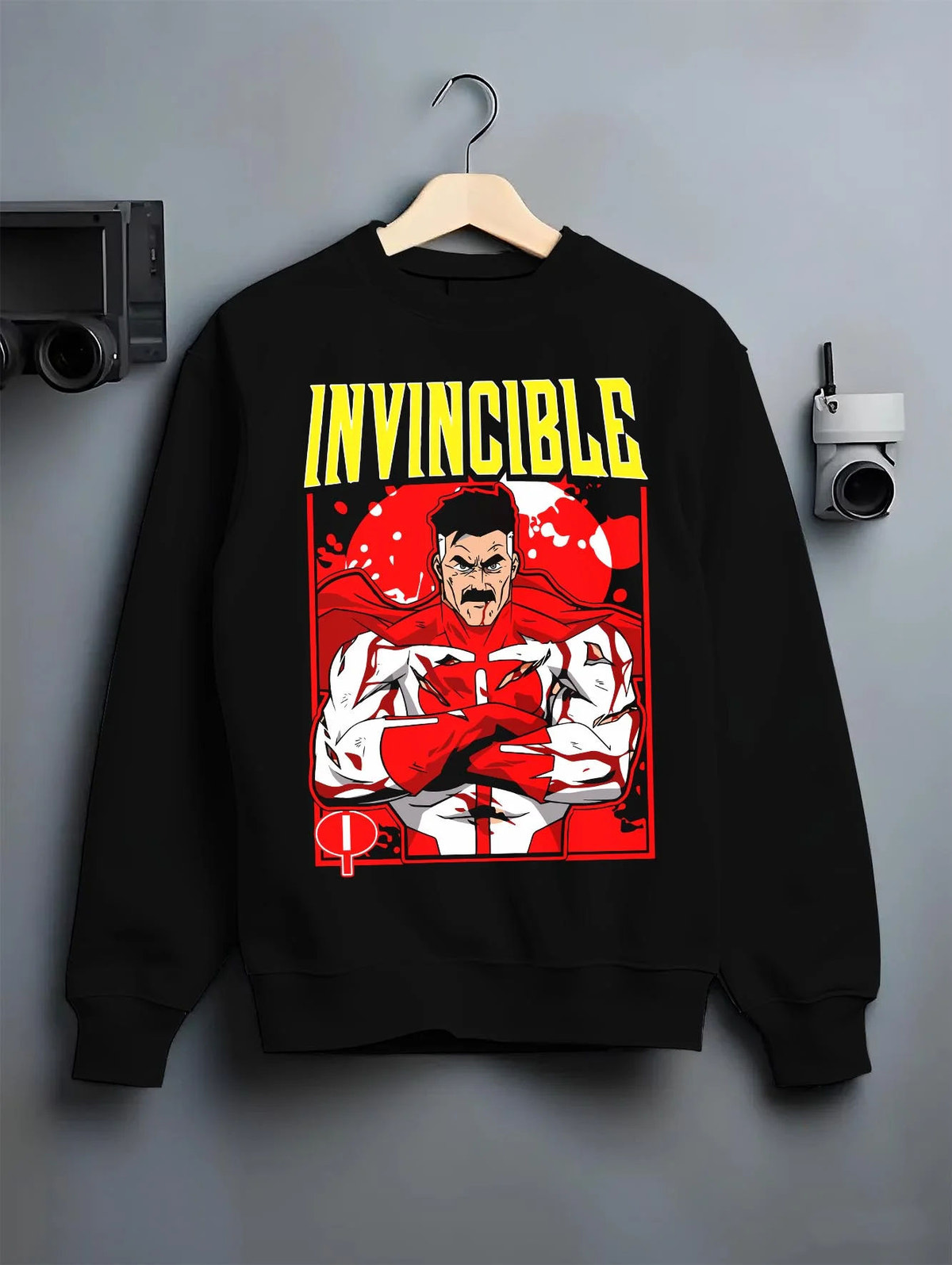 Black crewneck sweatshirt on hanger featuring Omni-Man Viltrumite battle power Invincible artwork.